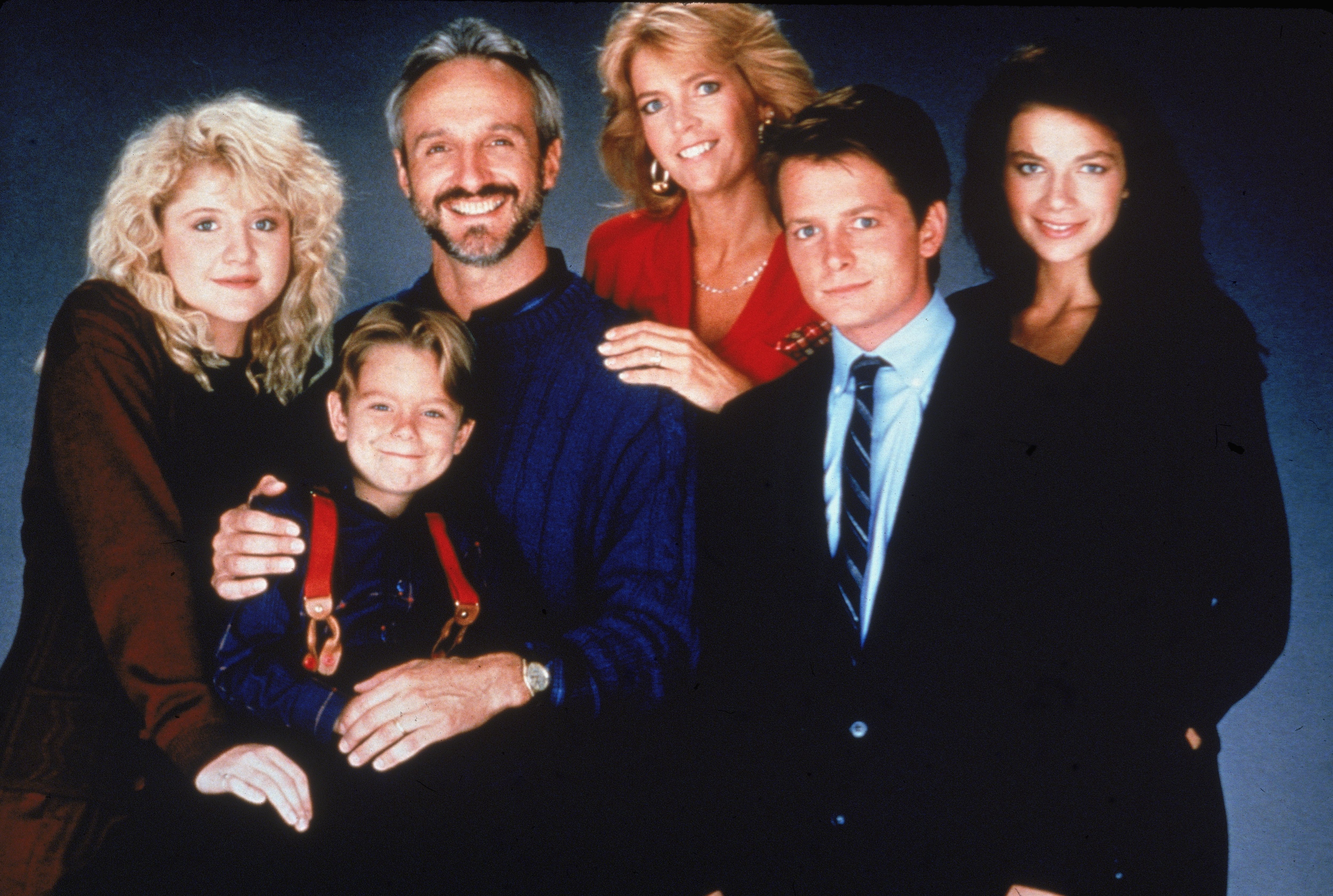 Tina Yothers, Brian Bonsall, Michael Gross, Meredith Baxter Birney, Michael J. Fox, and Justine Bateman in a promotional portrait for "Family Ties," circa 1989 | Source: Getty Images
