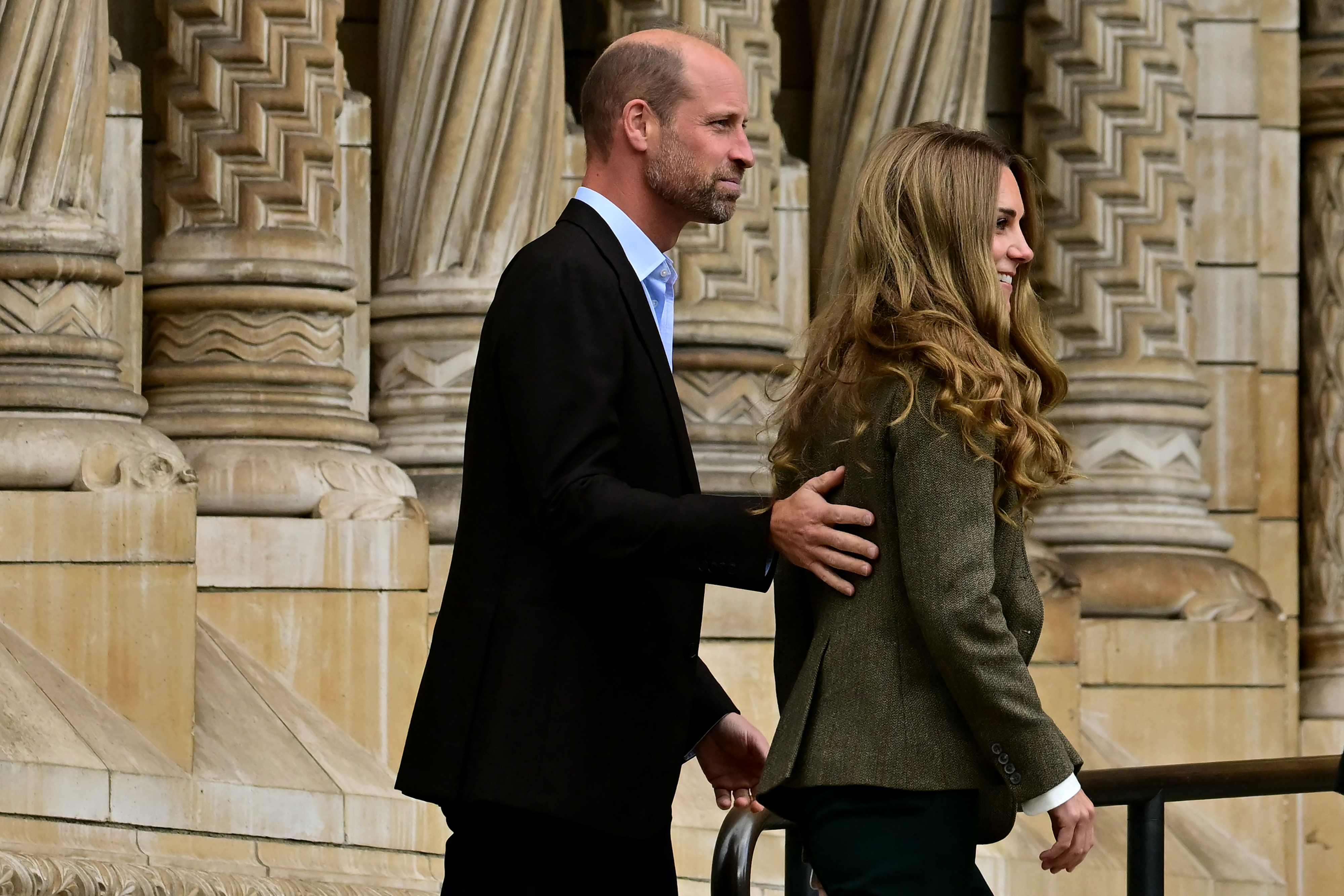 Captured from the side as she walks with Prince William, Princess Catherine's updated hair color is on full display. The honey-blonde waves cascade down her back, lending a softer glow to her otherwise structured look.