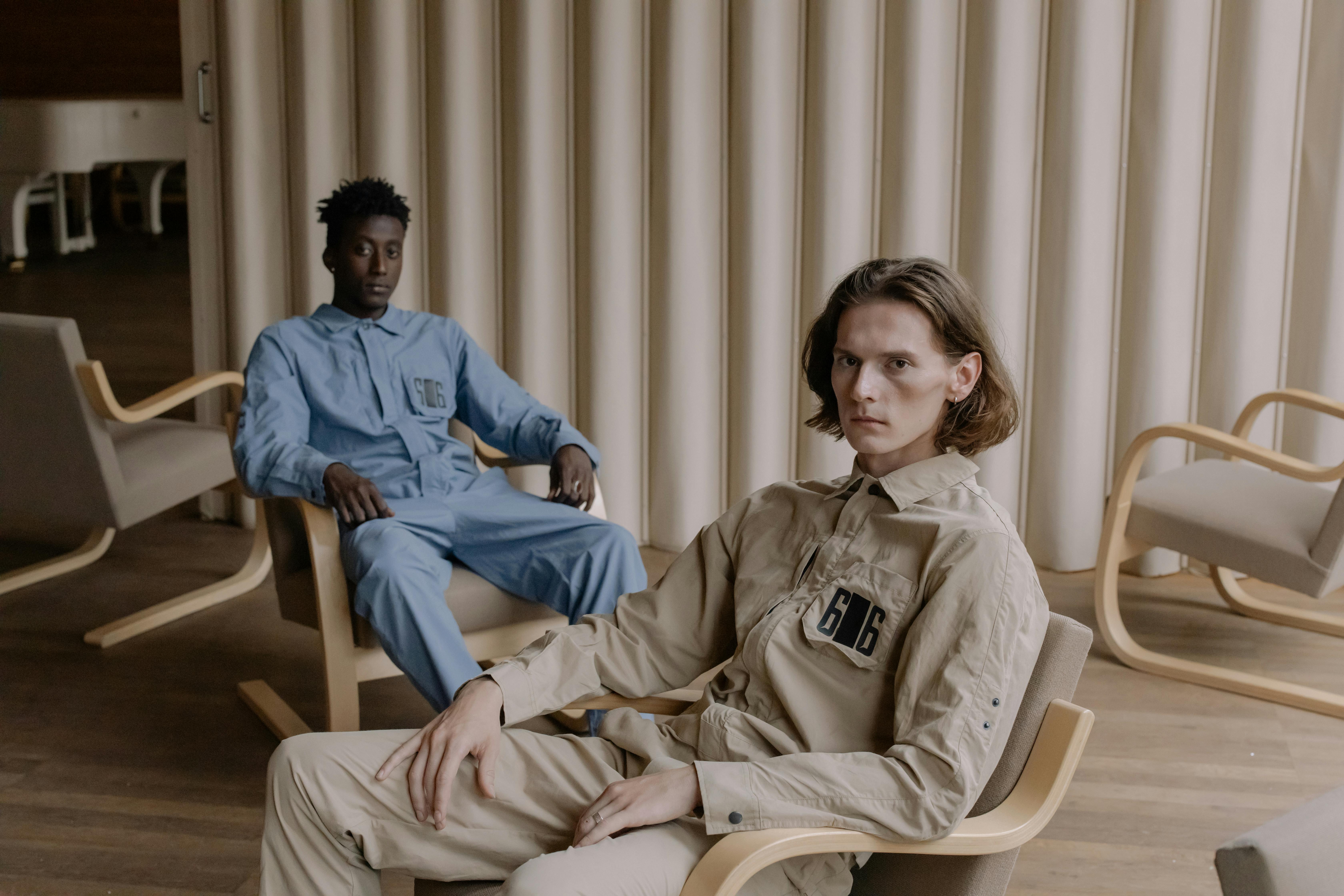 Two serious men sitting | Source: Pexels