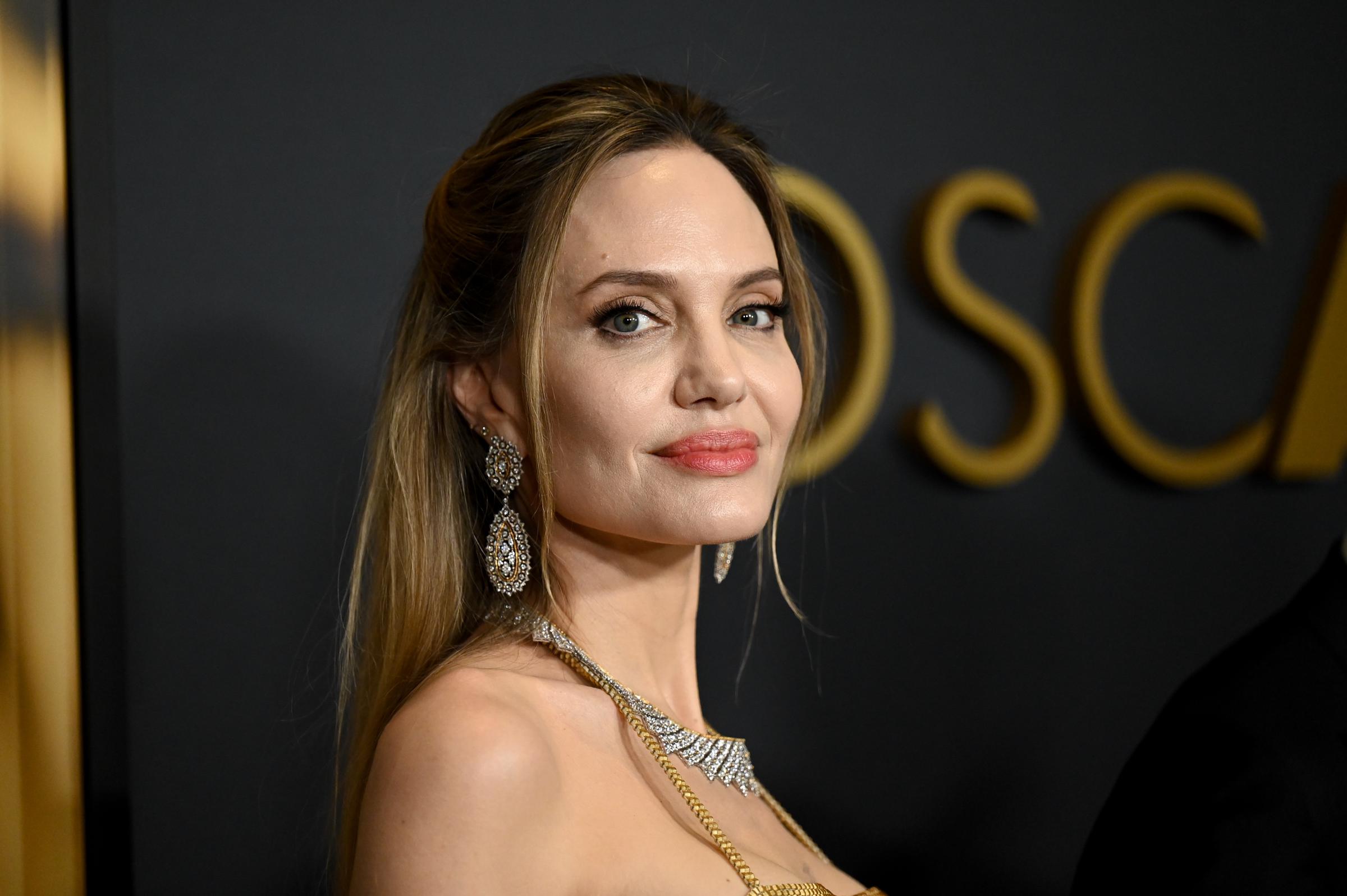 Angelina Jolie poses on the red carpet at the 15th Governors Awards on November 17, 2024, in Los Angeles, California. | Source: Getty Images