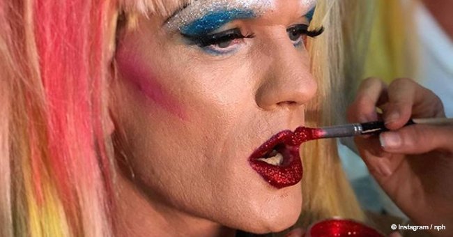 Neil Patrick Harris appeared on stage in bright makeup, a wig, and heels