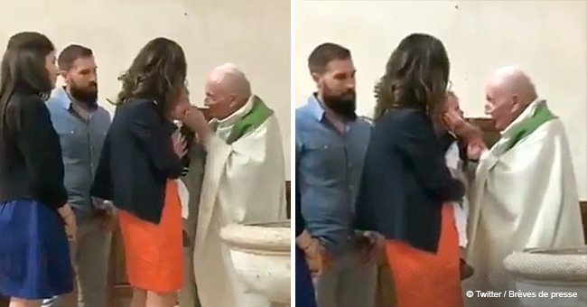 People outraged over video of priest slapping crying baby during baptism