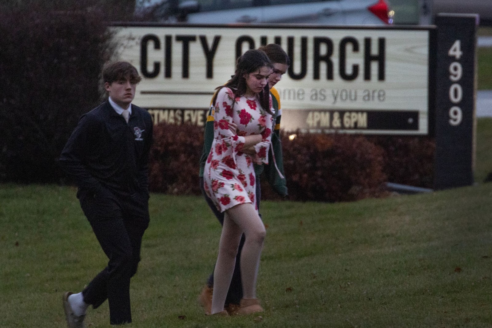 Students leaving a church next to the Abundant Life Christian School on December 16. | Source: Getty Images