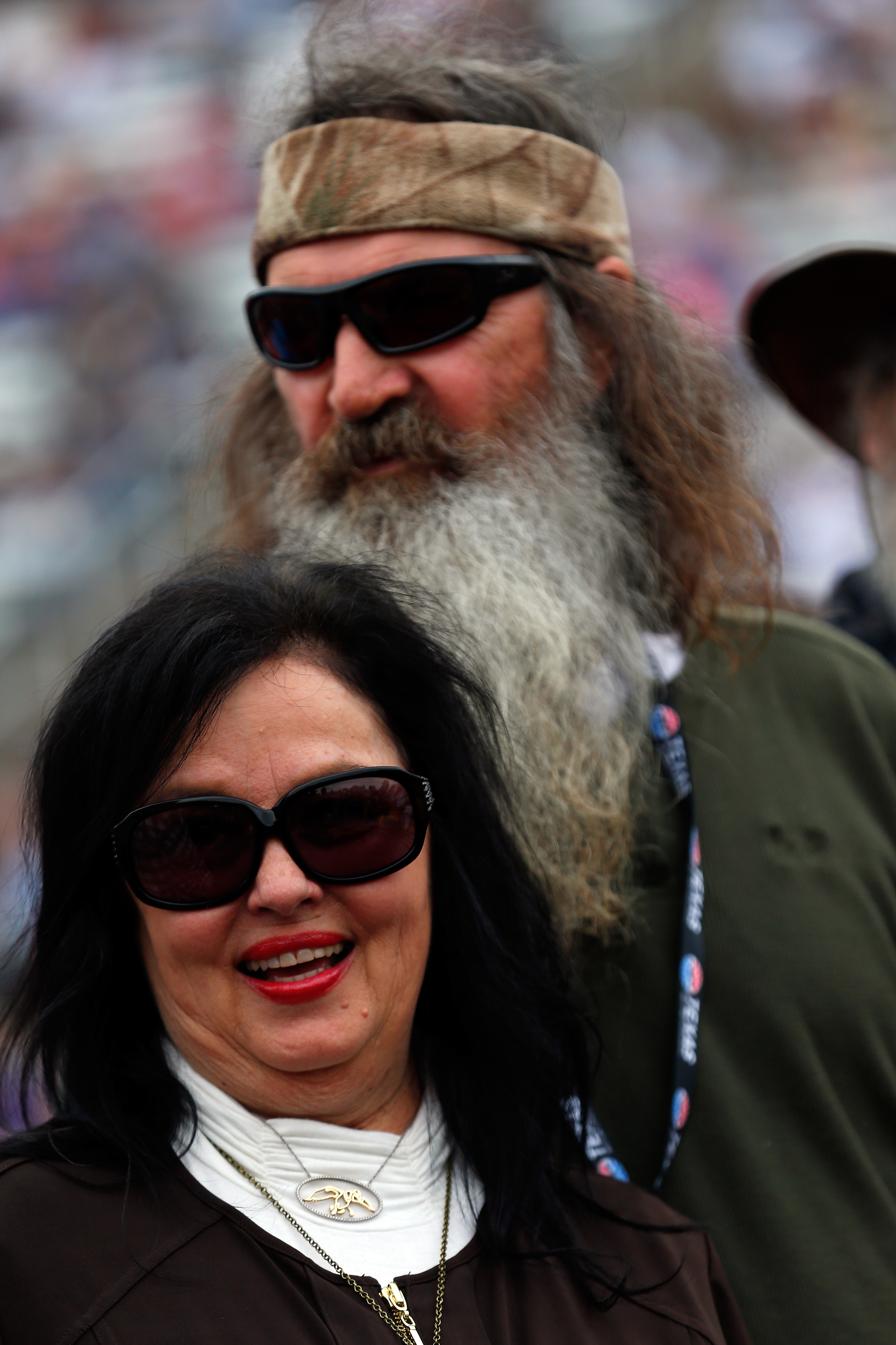 Kay and Phil Robertson take part in pre-race ceremonies for the NASCAR Sprint Cup Series Duck Commander 500 on April 11, 2015, in Fort Worth, Texas. | Source: Getty Images