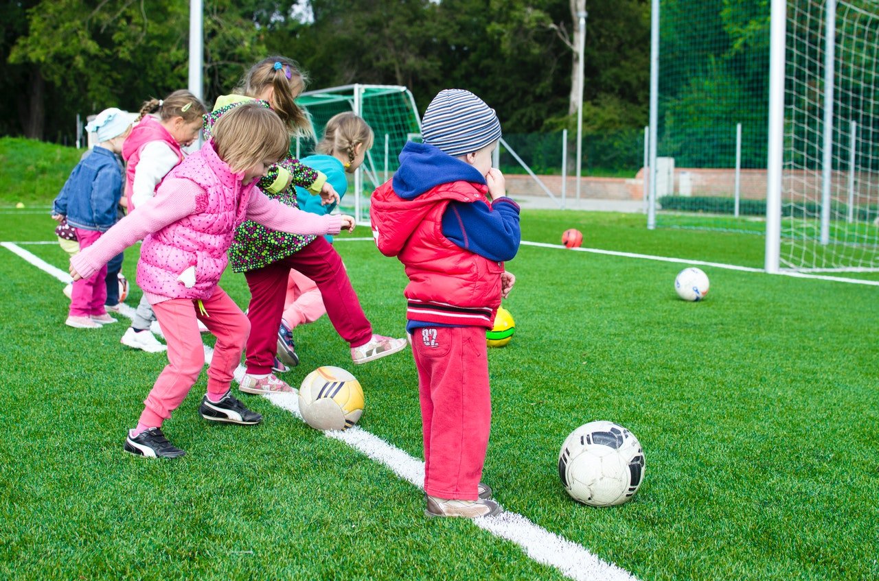 Photo of children playing on a soccer field. | Source: Pexels/Lukas