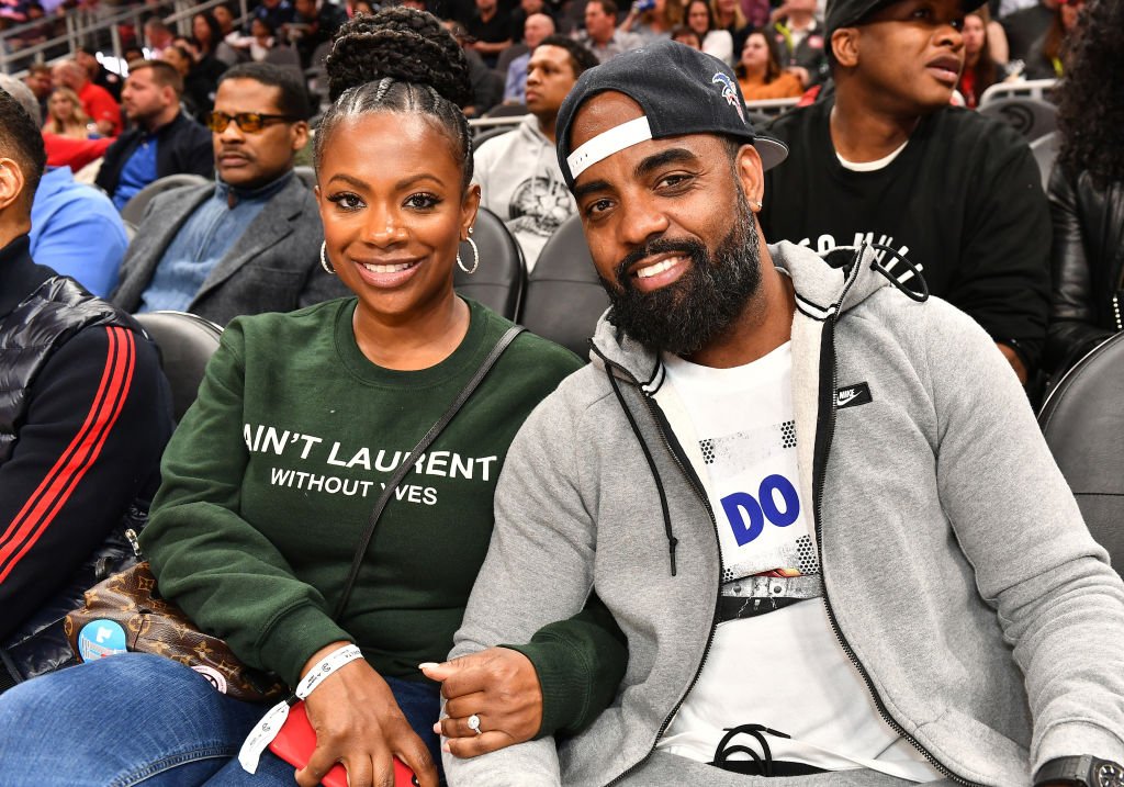 Kandi Burruss and Todd Tucker attend Charlotte Hornets vs Atlanta Hawks game at State Farm Arena on March 09, 2020 | Photo: Getty Images