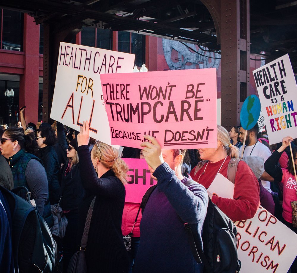 Signs advocating for healthcare at the Chicago Women's March on January 21, 2017 | Source: Shutterstock