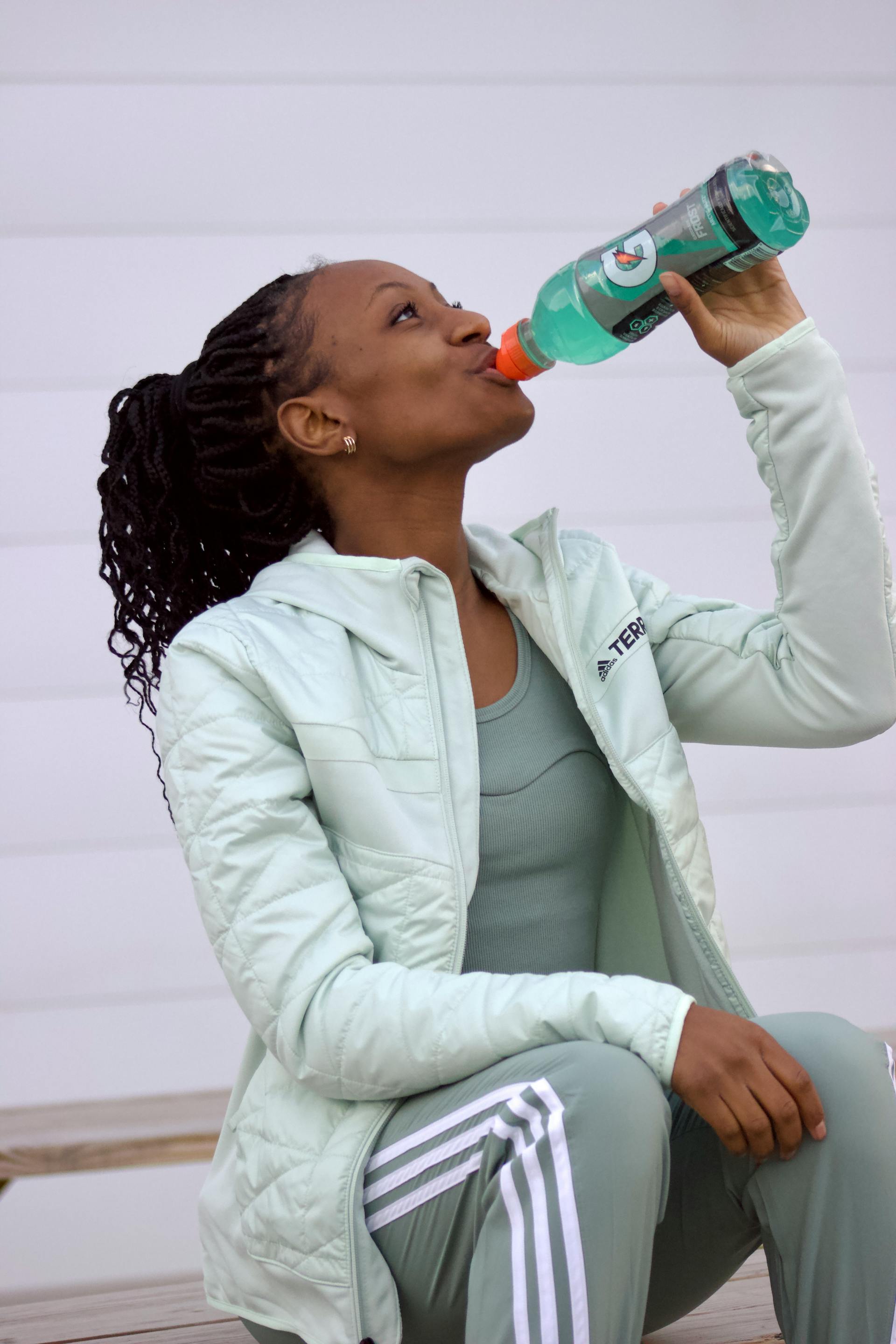 A woman drinking Gatorade | Source: Pexels