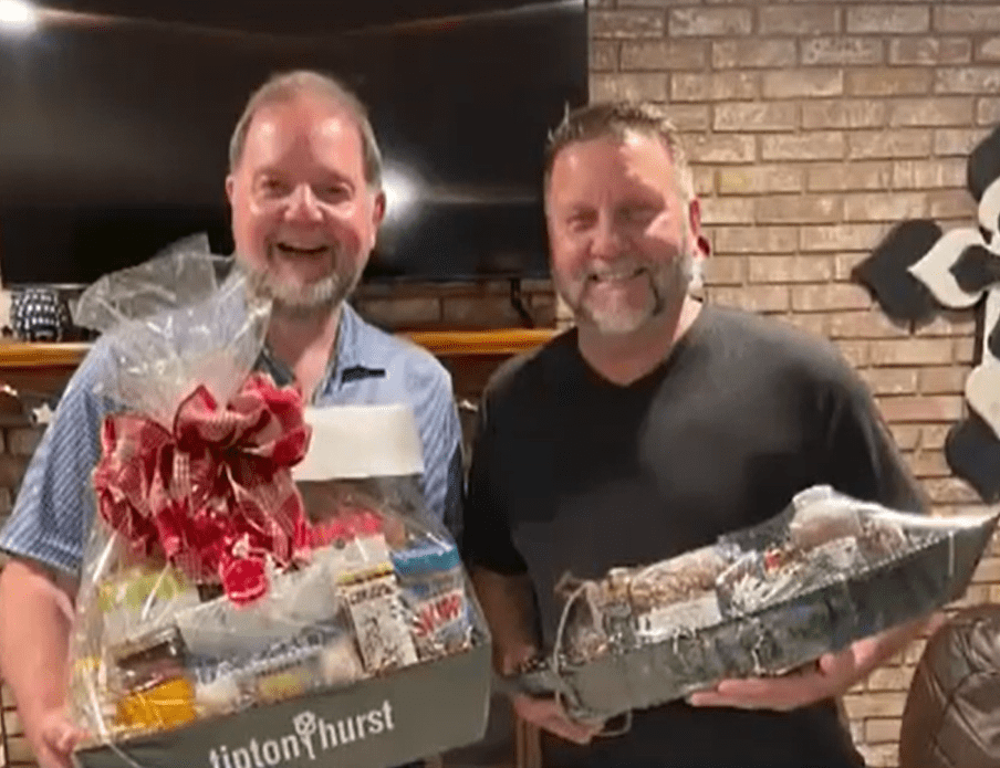 Biological brothers Lafe Jones and Randy Rogers holding gift bags.┃Source: youtube.com/ FOX 16 KLRT