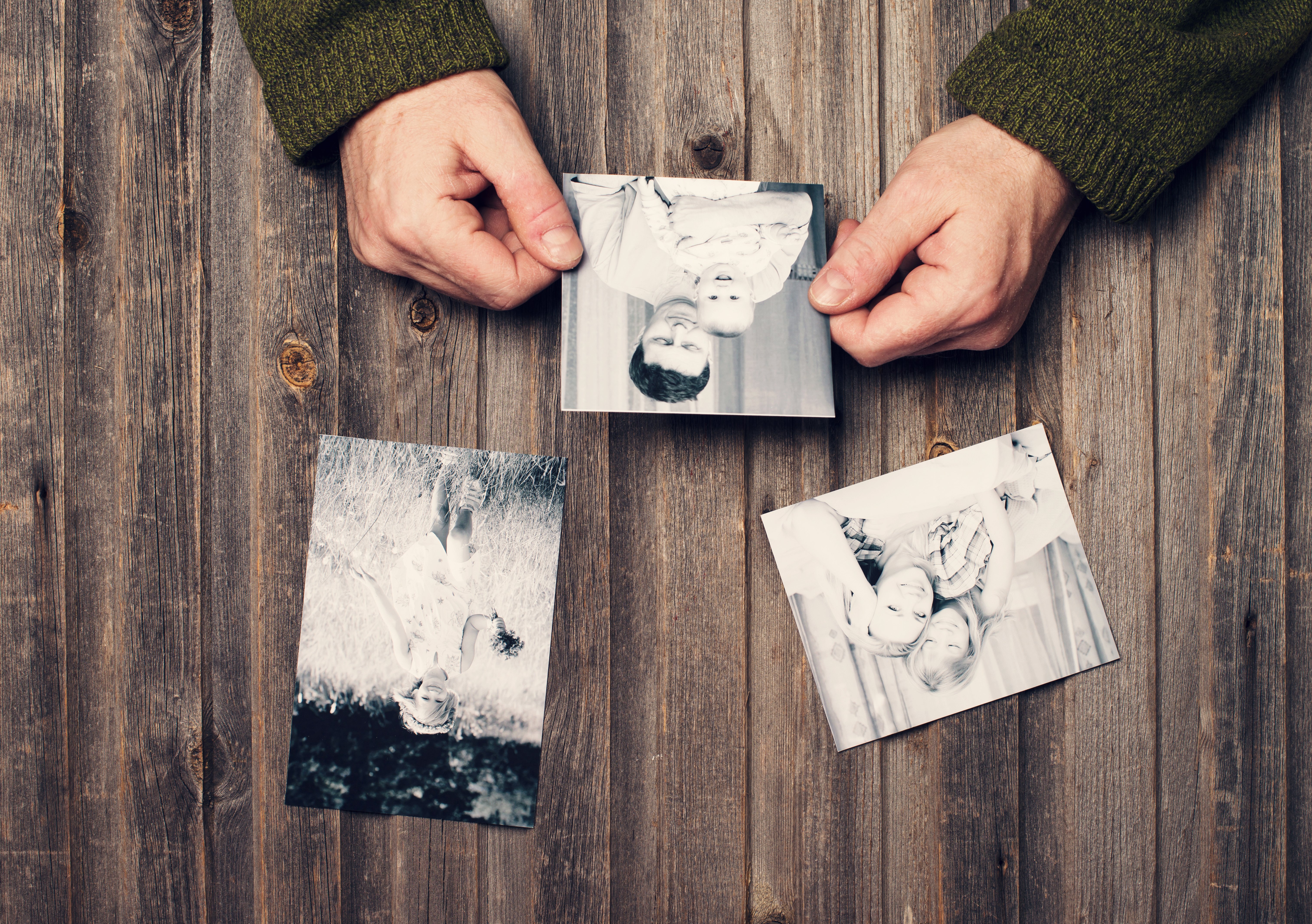 The envelope John gave Olivia had a few notes and a photo of Stephen holding her as a baby. | Source: Shutterstock