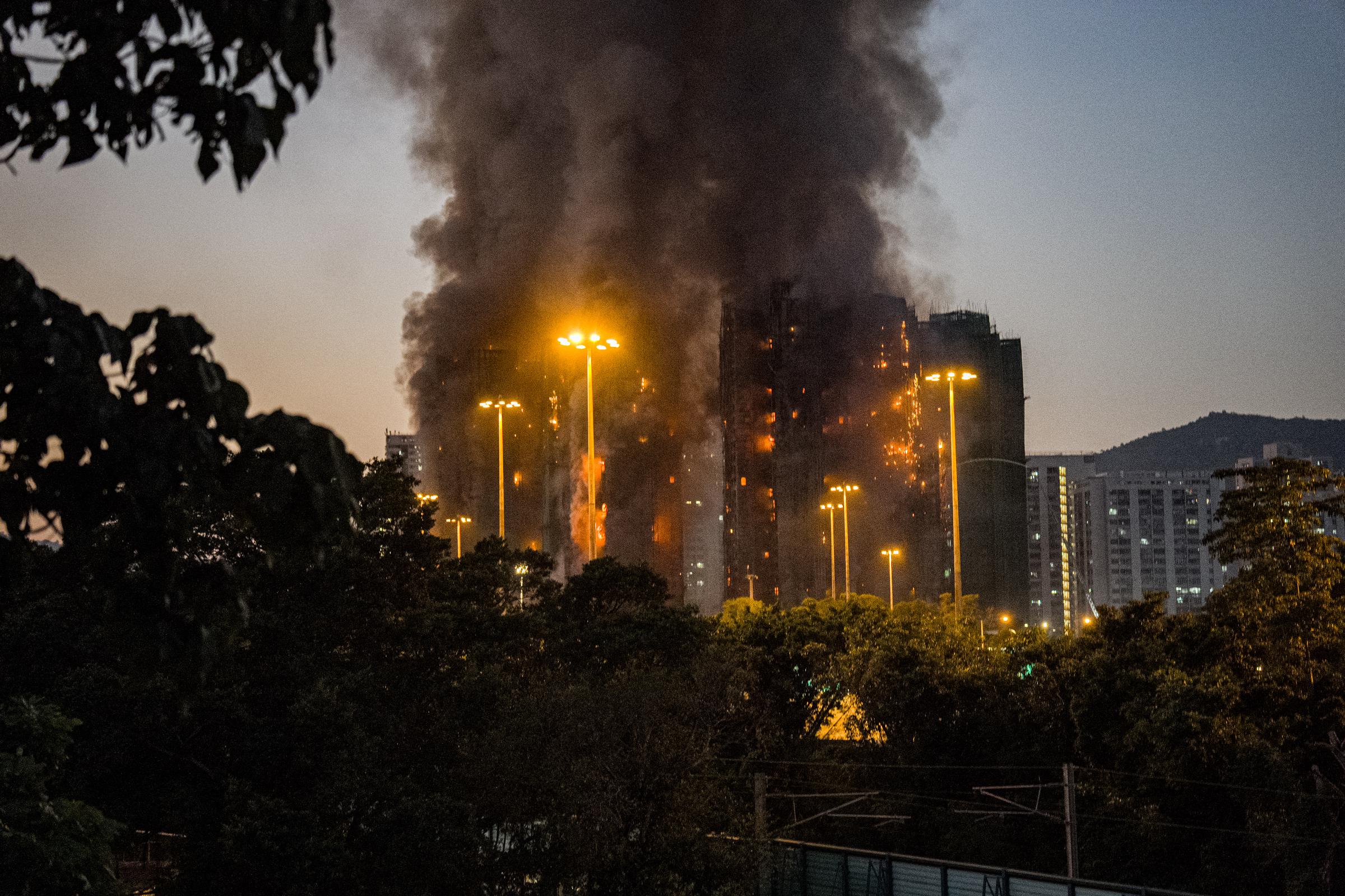 Flames and smoke engulf high-rise blocks in Tai Po, Hong Kong on November 26, 2025 | Source: Getty Images
