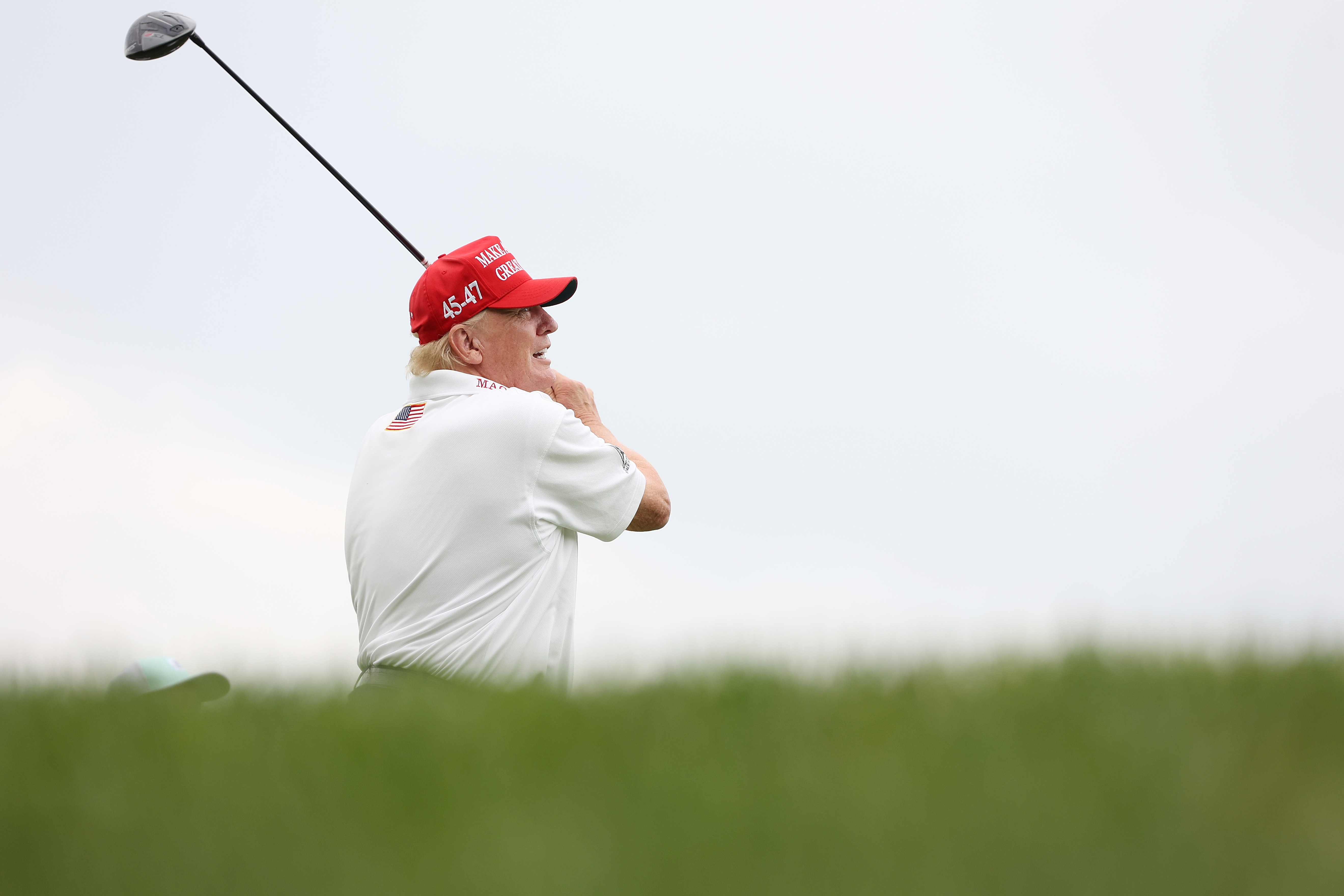 President Donald Trump hits his shot from the second tee during the pro-am prior to the LIV Golf Invitational - Bedminster at Trump National Golf Club on August 10, 2023, in Bedminster, New Jersey | Source: Getty Images