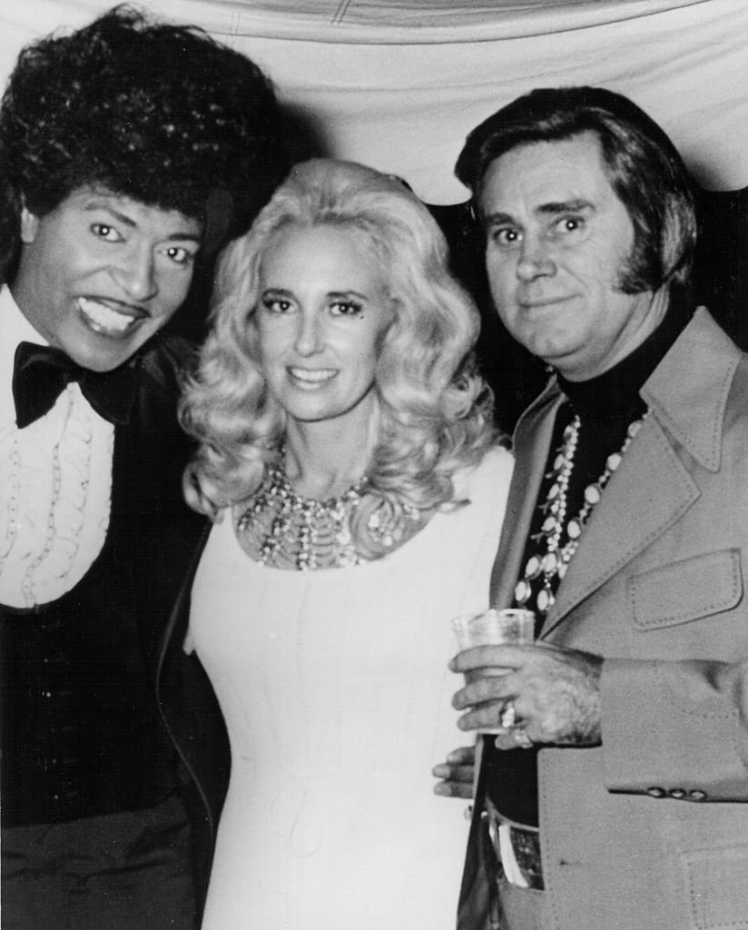 Musician Little Richard poses with married country couple Tammy Wynette and George Jones in circa 1972. | Source Getty Images