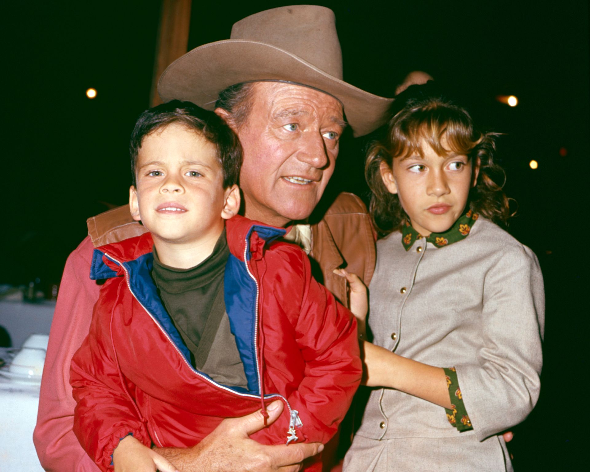 John Wayne and his two kids at a restaurant, circa 1967. | Source: Getty Images