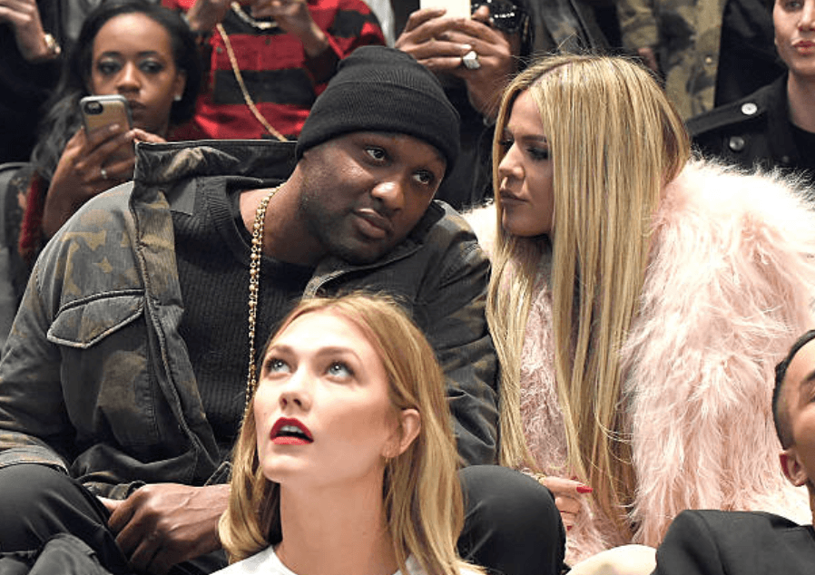 Lamar Odom chats with Khloe Kardashian as they sit in the audience during Kanye West Yeezy Season 3 performance, on February 11, 2016, at Madison Square Garden, New York City | Source: Kevin Mazur/Getty Images for Yeezy Season 3