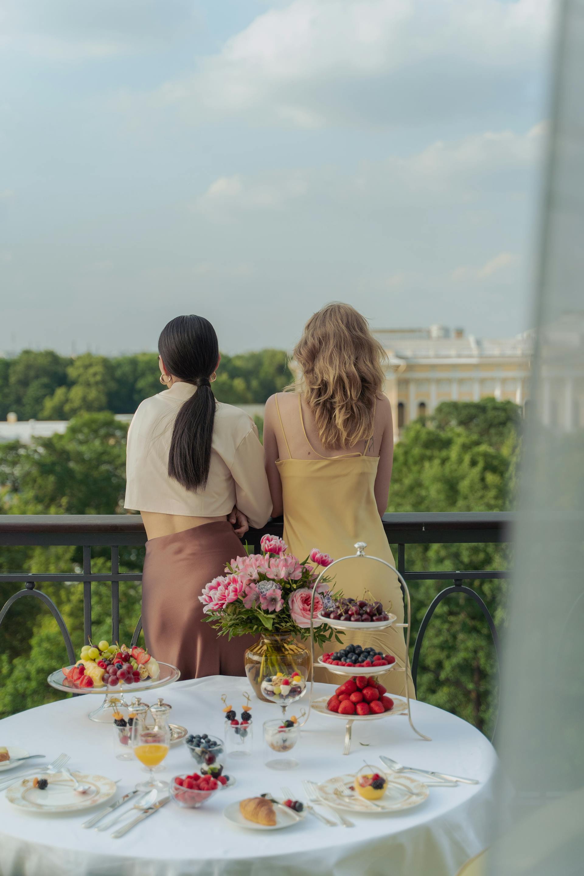 A back view of women standing in a balcony | Source: Pexels