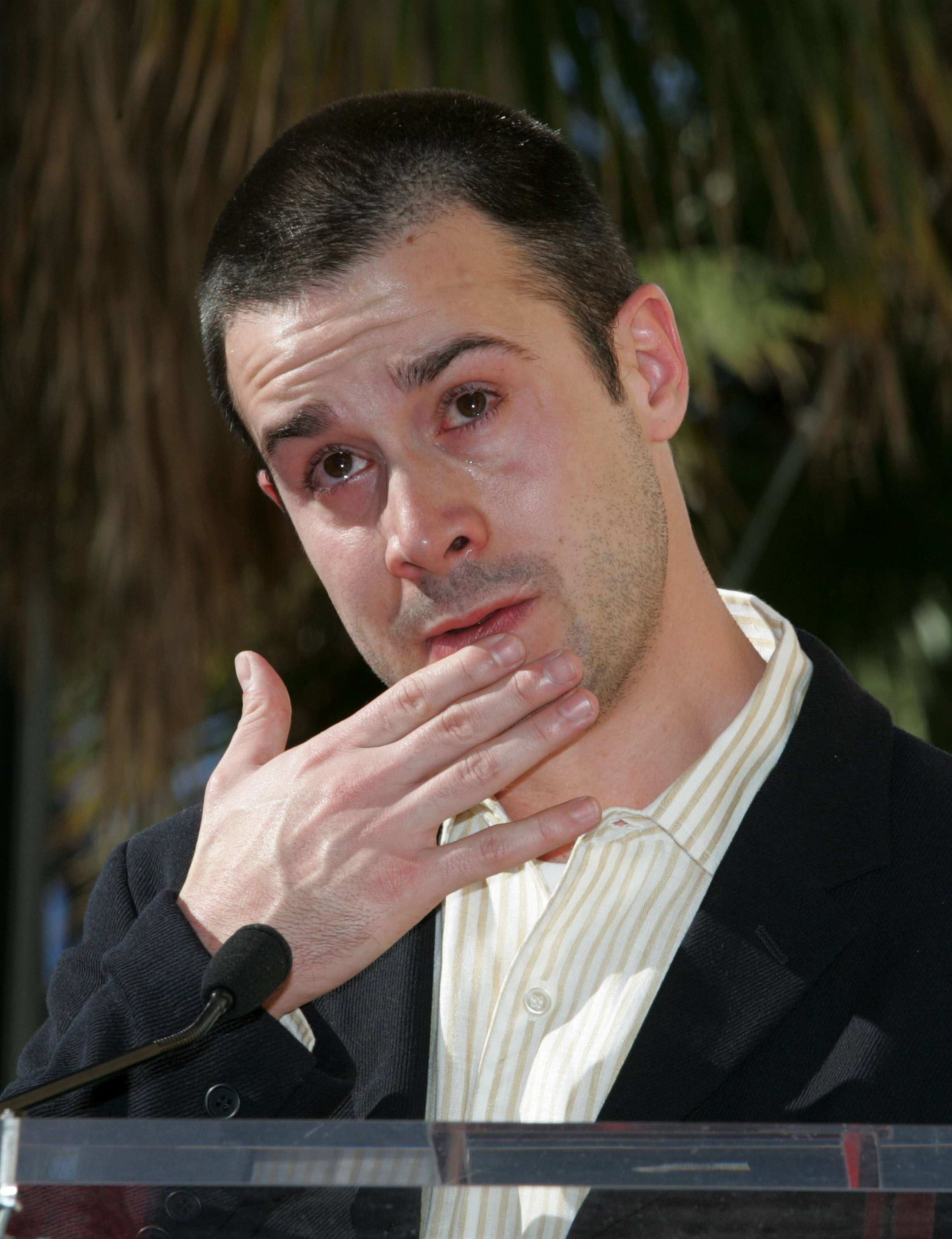 Freddie Prinze Jr. tearing up as he speaks during a star dedication ceremony for Freddie Prinze on the Hollywood Walk of Fame on December 14, 2004, in Hollywood, California. | Source: Getty Images