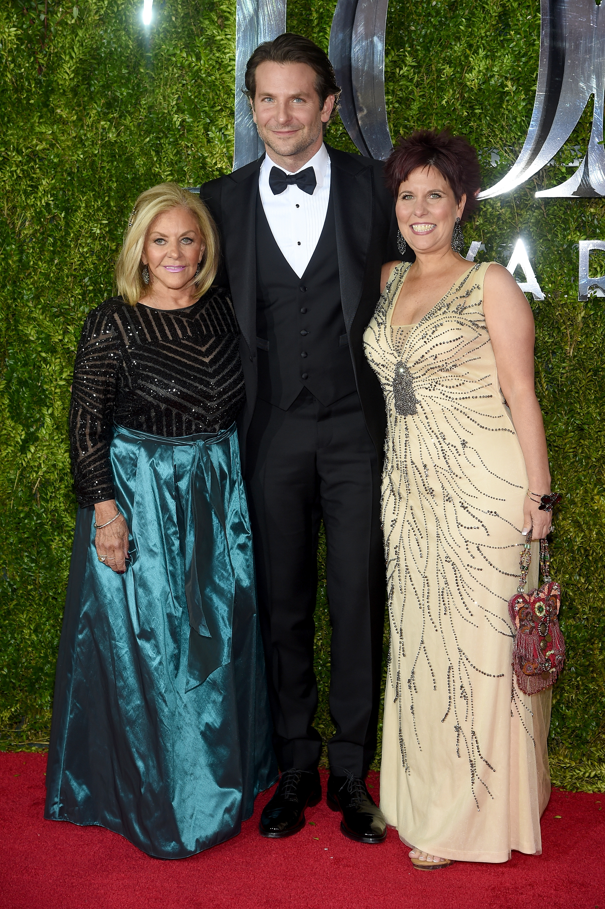 Gloria Campano, Bradley Cooper, and his sister Holly Cooper attend the 2015 Tony Awards at Radio City Music Hall on June 7, 2015, in New York City. | Source: Getty Images