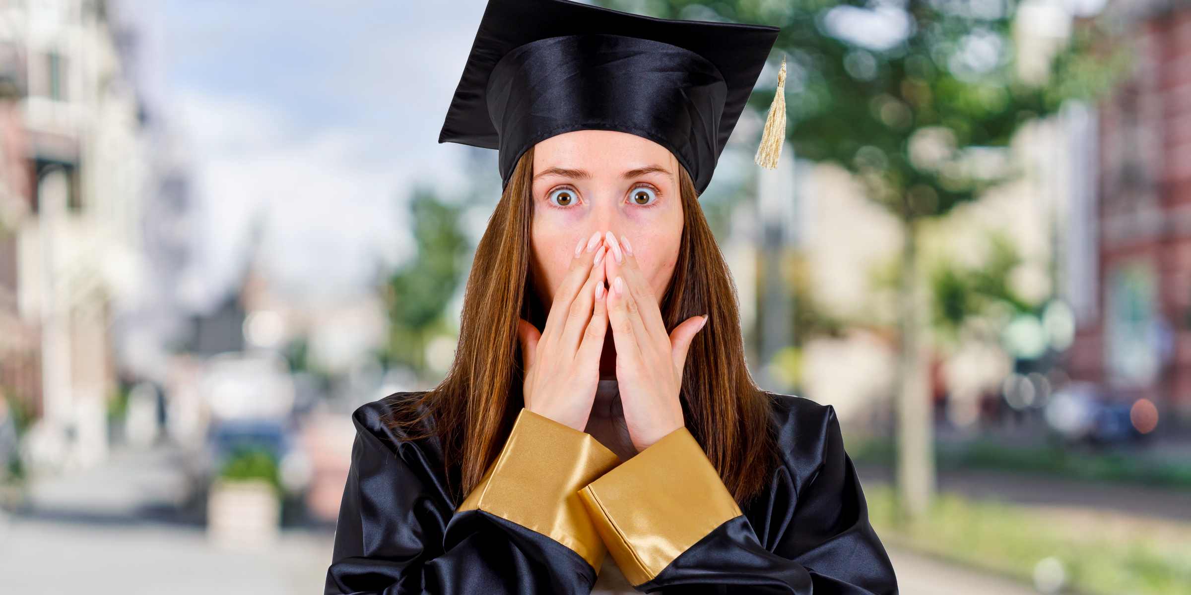 Shocked woman at her graduation | Source: Freepik