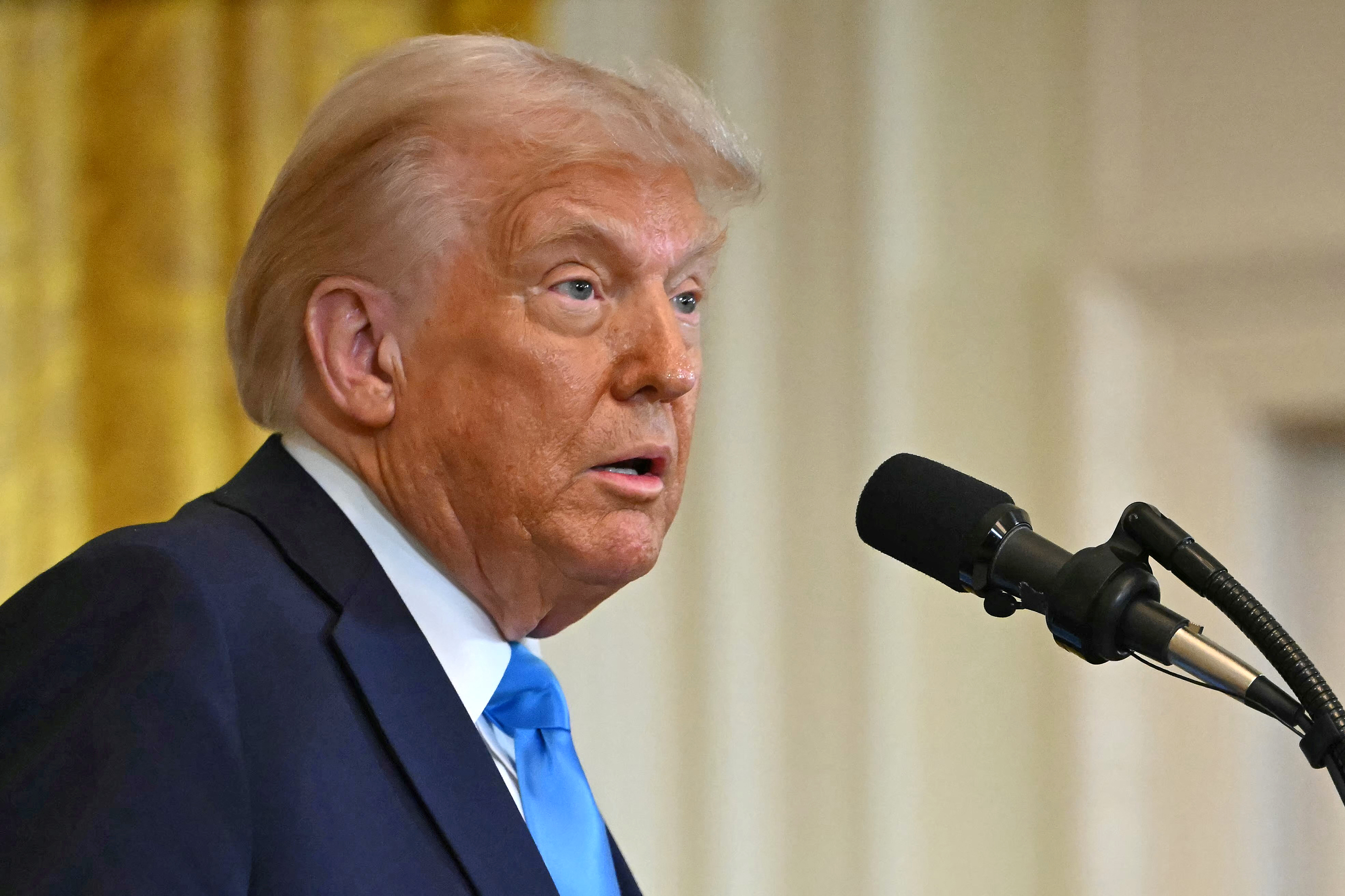 Donald Trump speaks at a press conference with unseen Israel's Prime Minister Benjamin Netanyahu in the East Room of the White House in Washington, D.C., on February 4, 2025 | Source: Getty Images