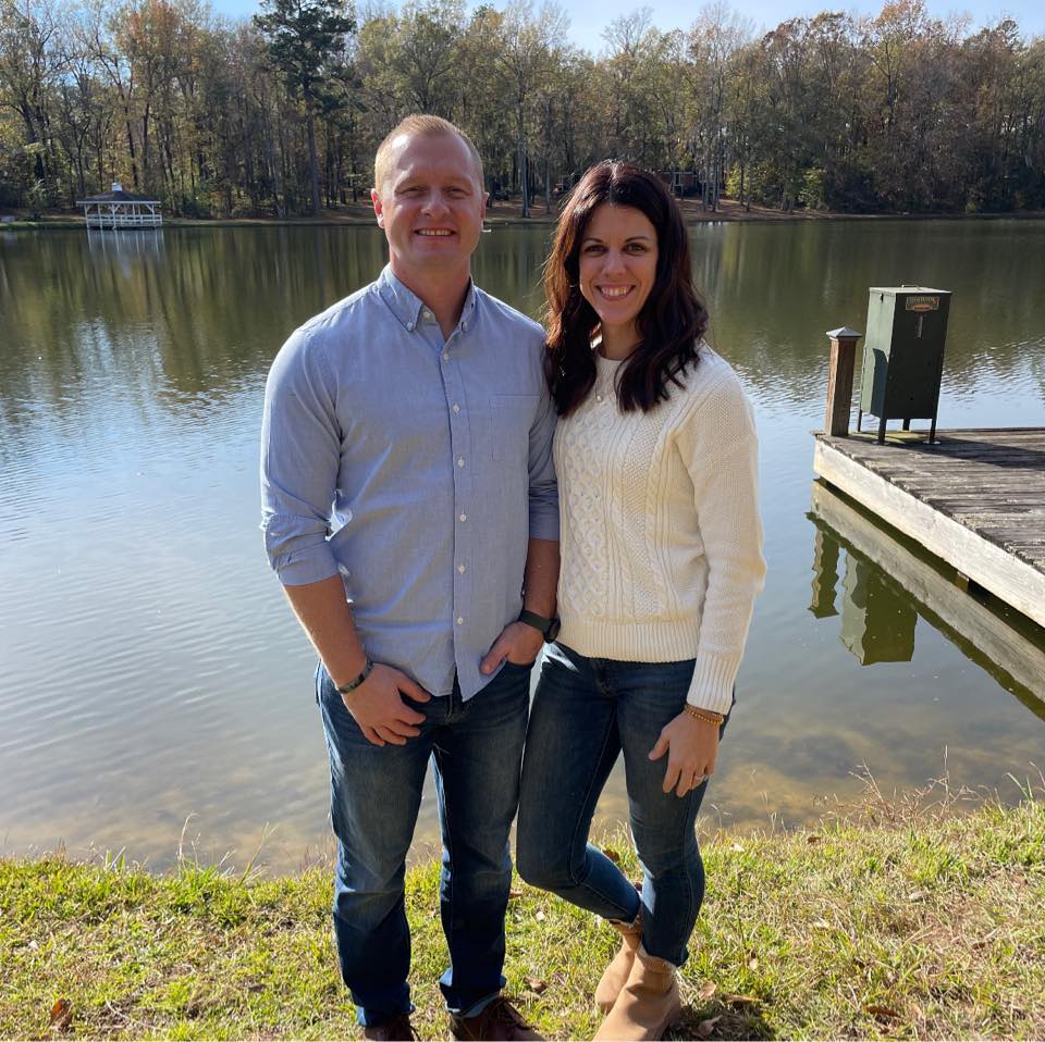 Jason and Laura Hughes posing on a pier, from a post dated December 21, 2023 | Source: Facebook/Laura Palmer Hughes