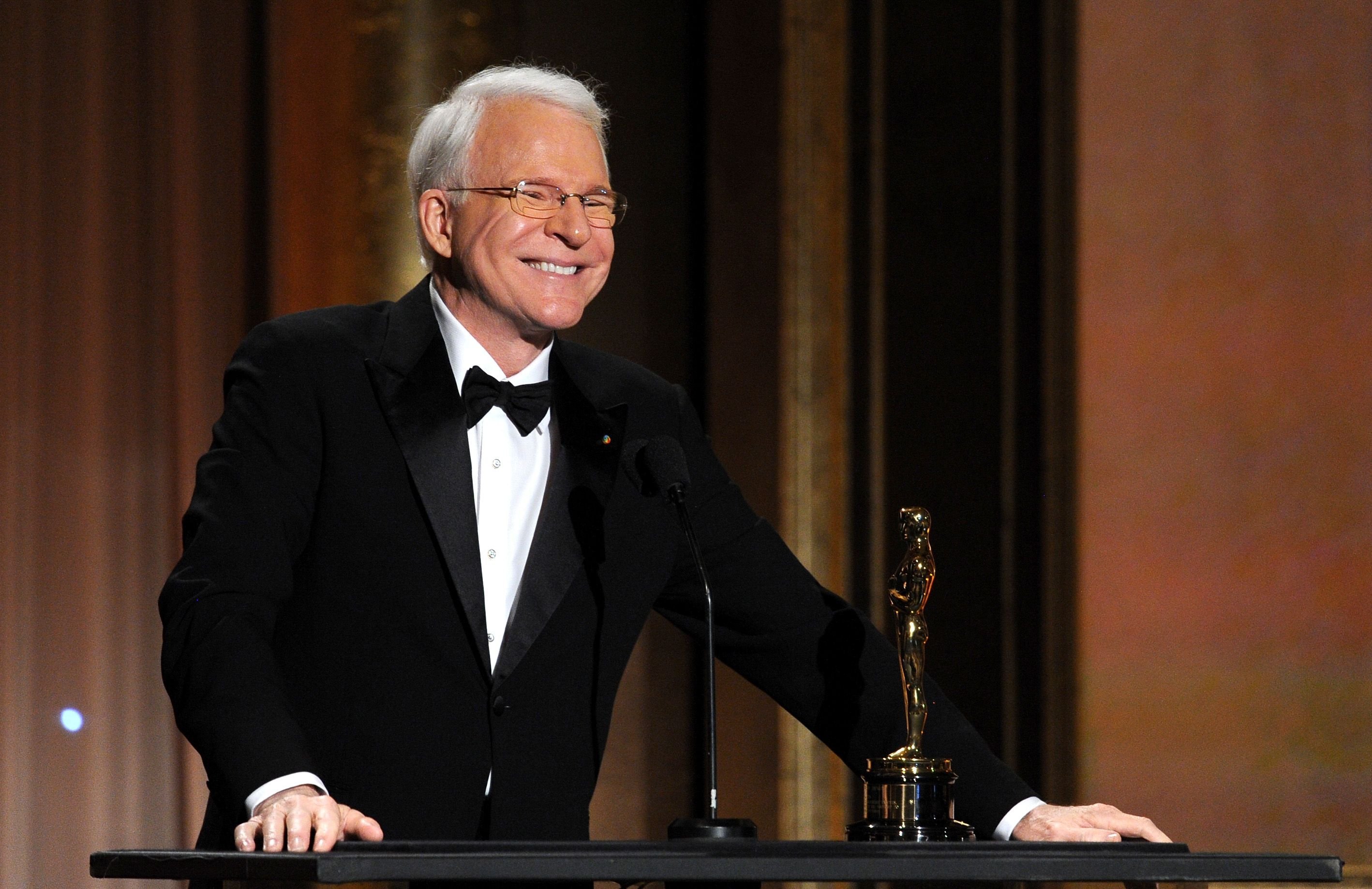 Steve Martin accepts honorary award onstage during the Academy of Motion Picture Arts and Sciences' Governors Awards. | Source: Getty Images