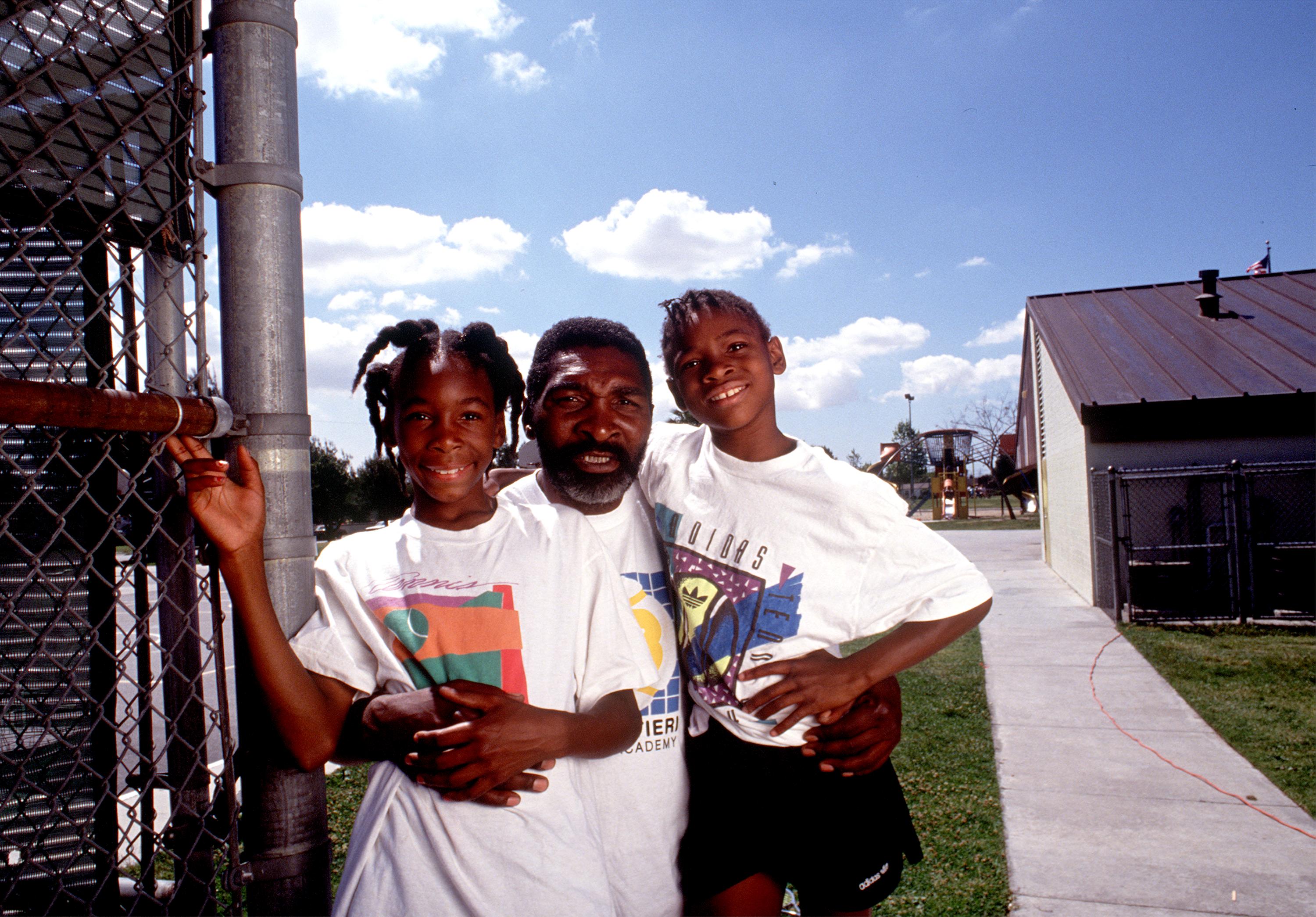 Richard Williams, center, with his daughters Venus, left, and Serena 1991 in Compton, CA. | Source: Getty Images 
