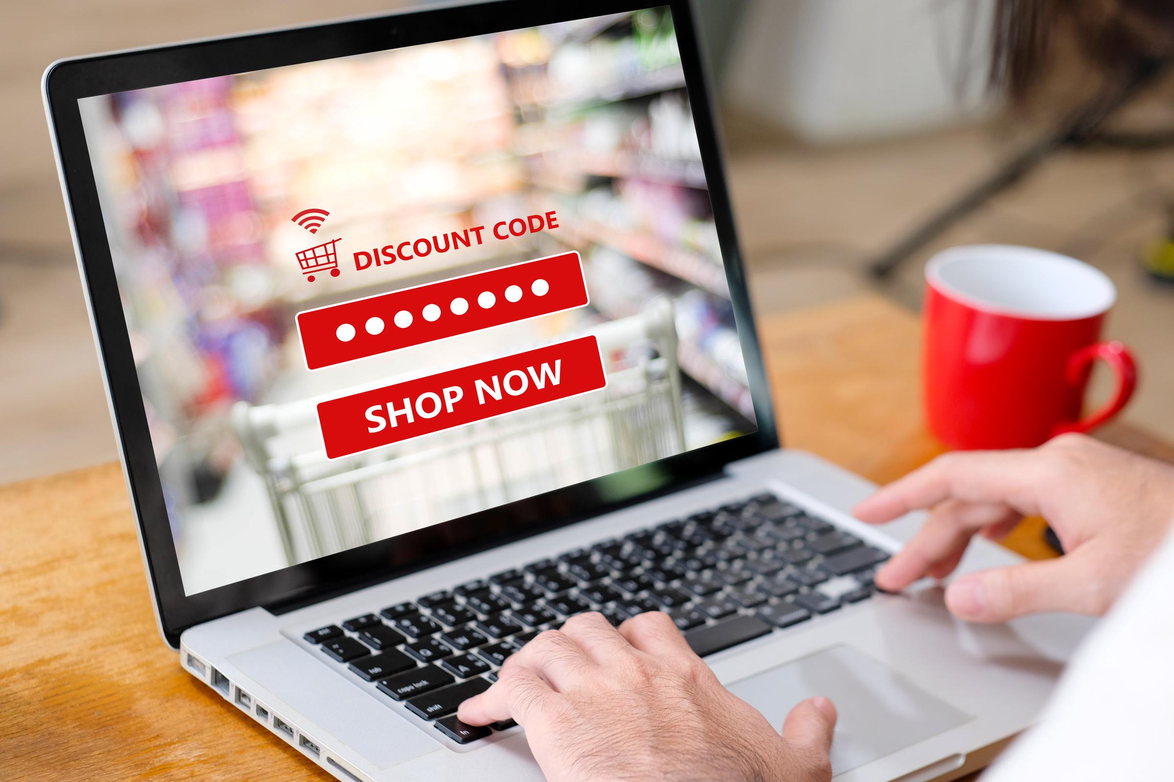 Person accessing a grocery discount online | Source: Shutterstock