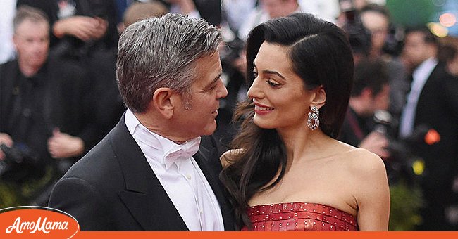 Actor George Clooney in a photo with his wife Amal Clooney at an event. | Photo: Getty Images