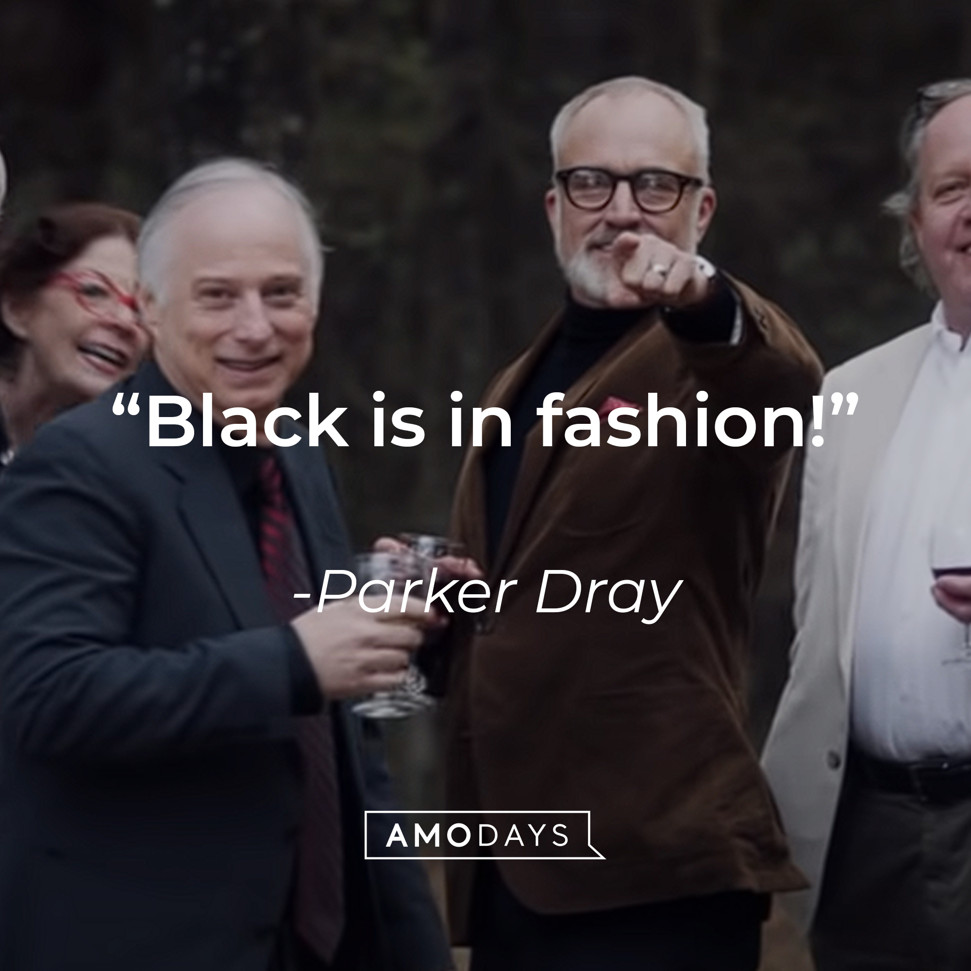 An image of Dean Armitage with another individual with Parker Dray’s quote: “Black is in fashion!”| Source: youtube.com/UniversalpicturesIta