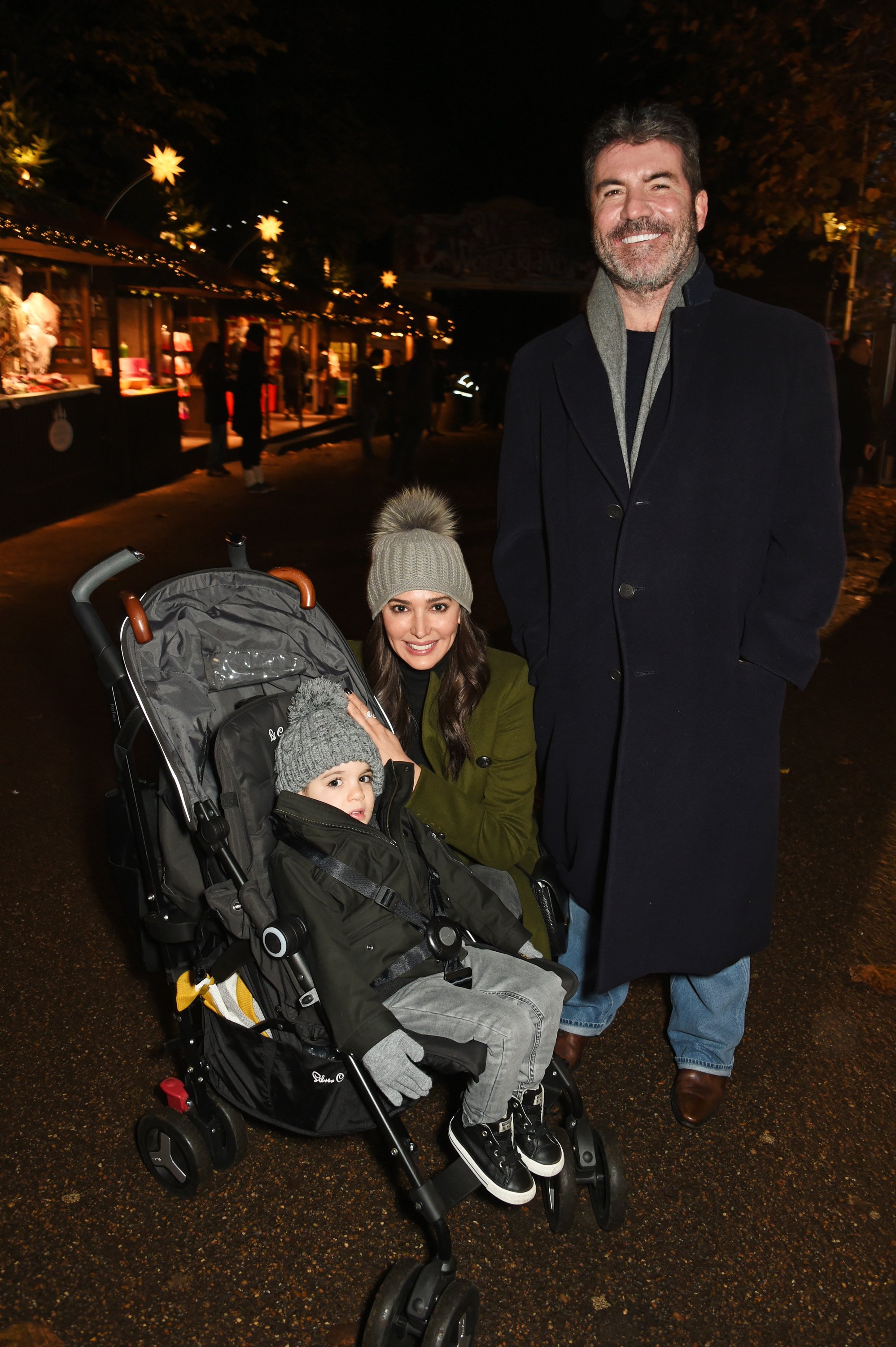 Simon Cowell, Lauren Silverman, and son Eric Cowell at a VIP Preview of Hyde Park's Winter Wonderland on November 17, 2016, in London, United Kingdom. | Source: Getty Images