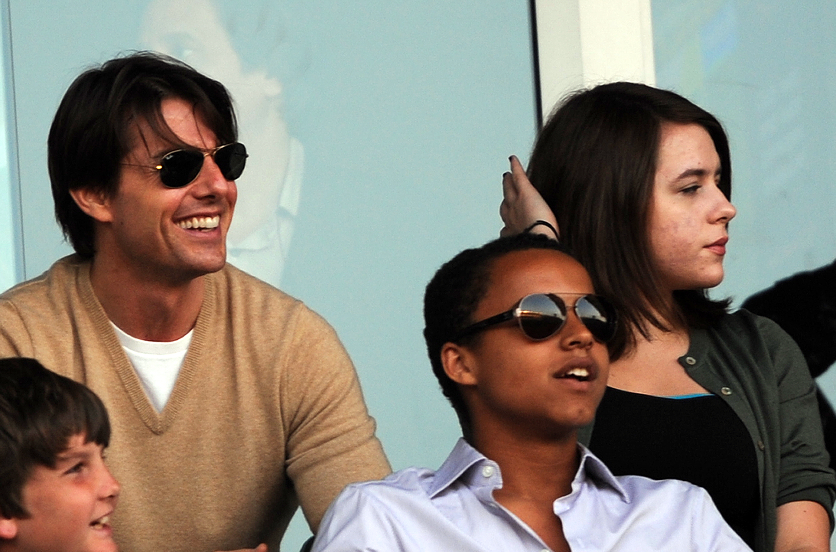 Tom Cruise and his children Connor (C) and Isabella (R) during a friendly game in Carson, California on July 19, 2009 | Source: Getty Images