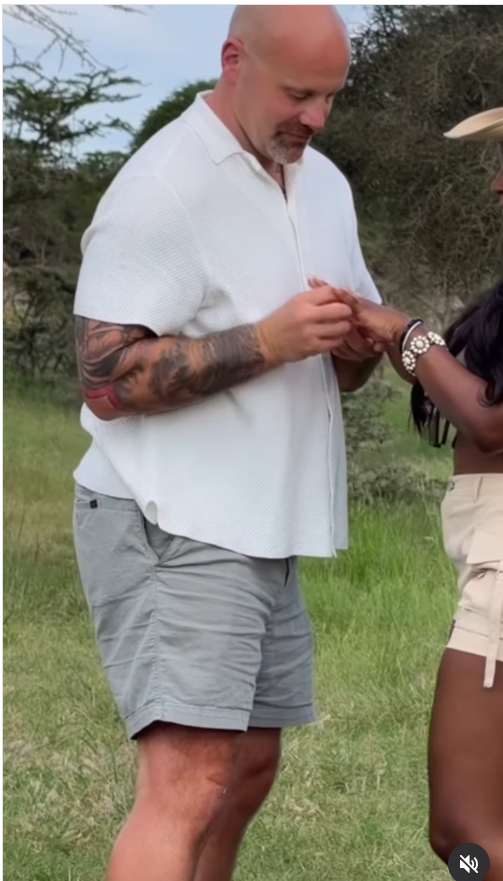 Joe McCann carefully slips the ring onto Ashly Robinson’s finger, the quiet exchange capturing the exact moment their story shifts into something lifelong. | Source: Instagram/ashleejenae