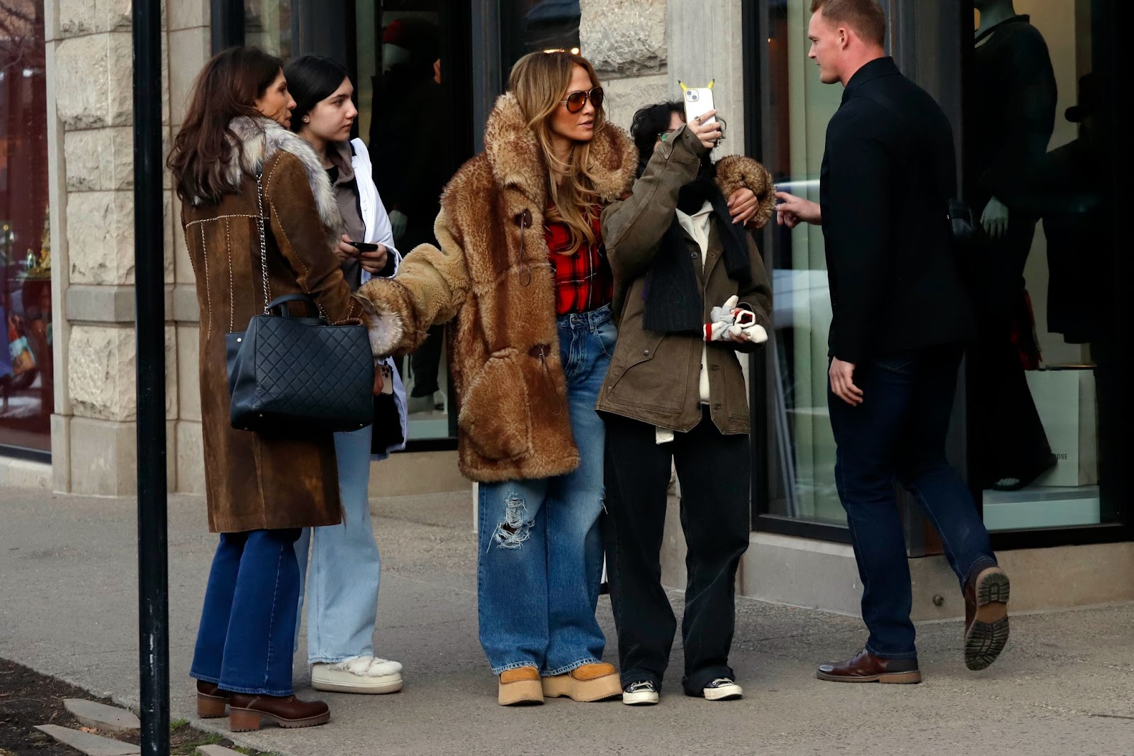 Jennifer Lopez taking pictures with fans in Aspen, Colorado, on December 24, 2024. | Source: Getty Images