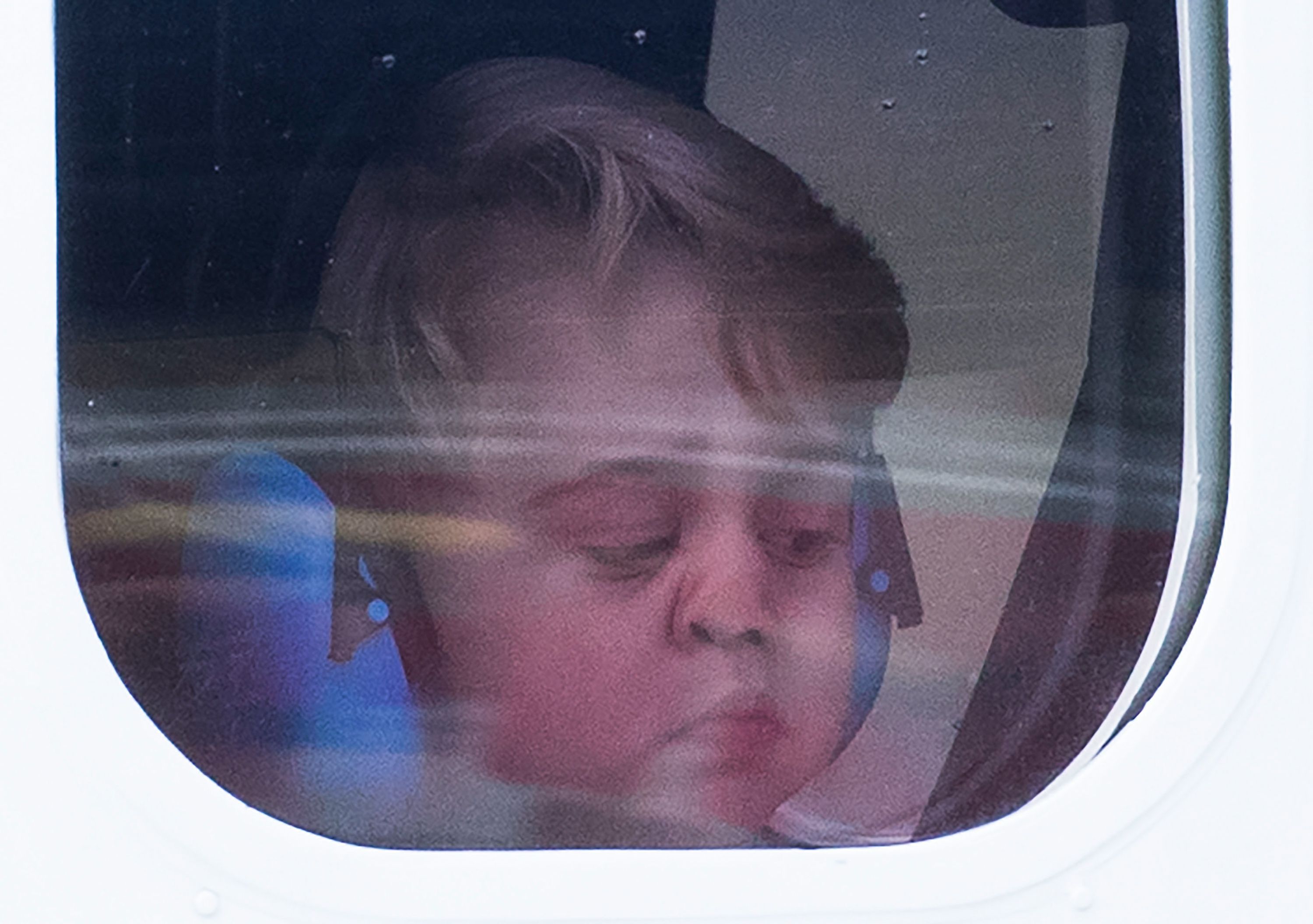 Prince George looks out of the window of a sea plane as he departs Victoria on October 1, 2016 in Victoria, Canada. | Photo: Getty Images