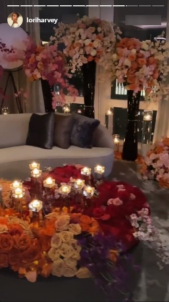 Lori Harvey shares a picture of her hotel room filled with candles and flowers on Valentine's day. | Photo: Instagram/Loriharvey