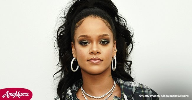 Rihanna shows off her torso in a sizzling 60's inspired white outfit at recent appearance