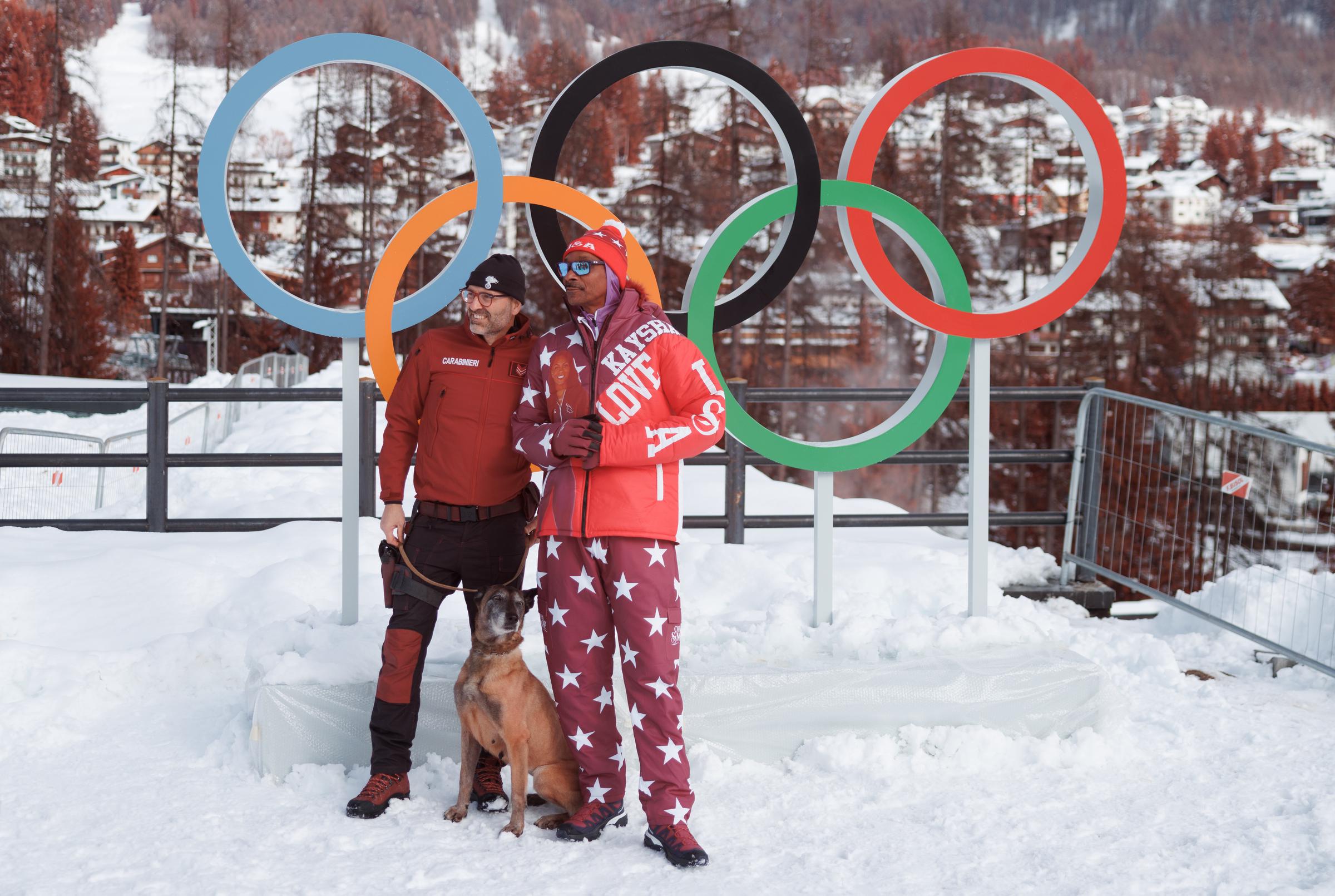 Snoop Dogg meets a security guard and a dog during the Winter Olympic Games at Cortina Sliding Centre on February 6, 2026, in Cortina d'Ampezzo, Italy | Source: Getty Images