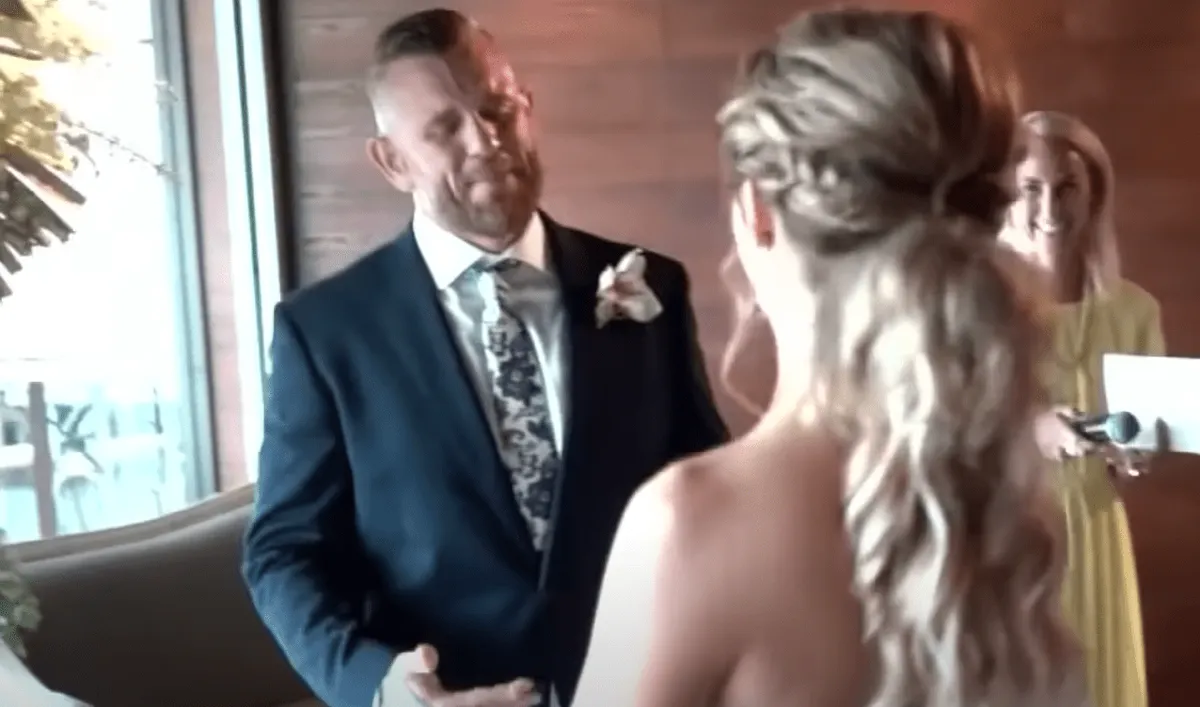 A deaf groom receives his bride at the altar and is overcome with emotion | Photo: Youtube/Inside Edition