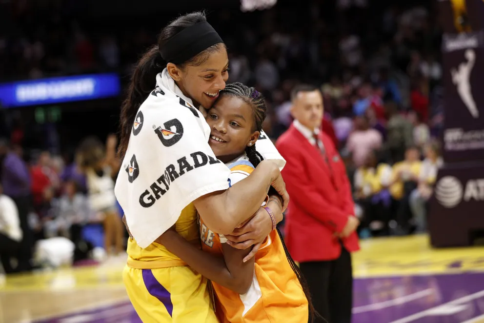 Candace Parkerhugs her daughter, Lailaa Nicole Williams, after winning the game against the Phoenix Mercury in 2019 | Source: Getty Images