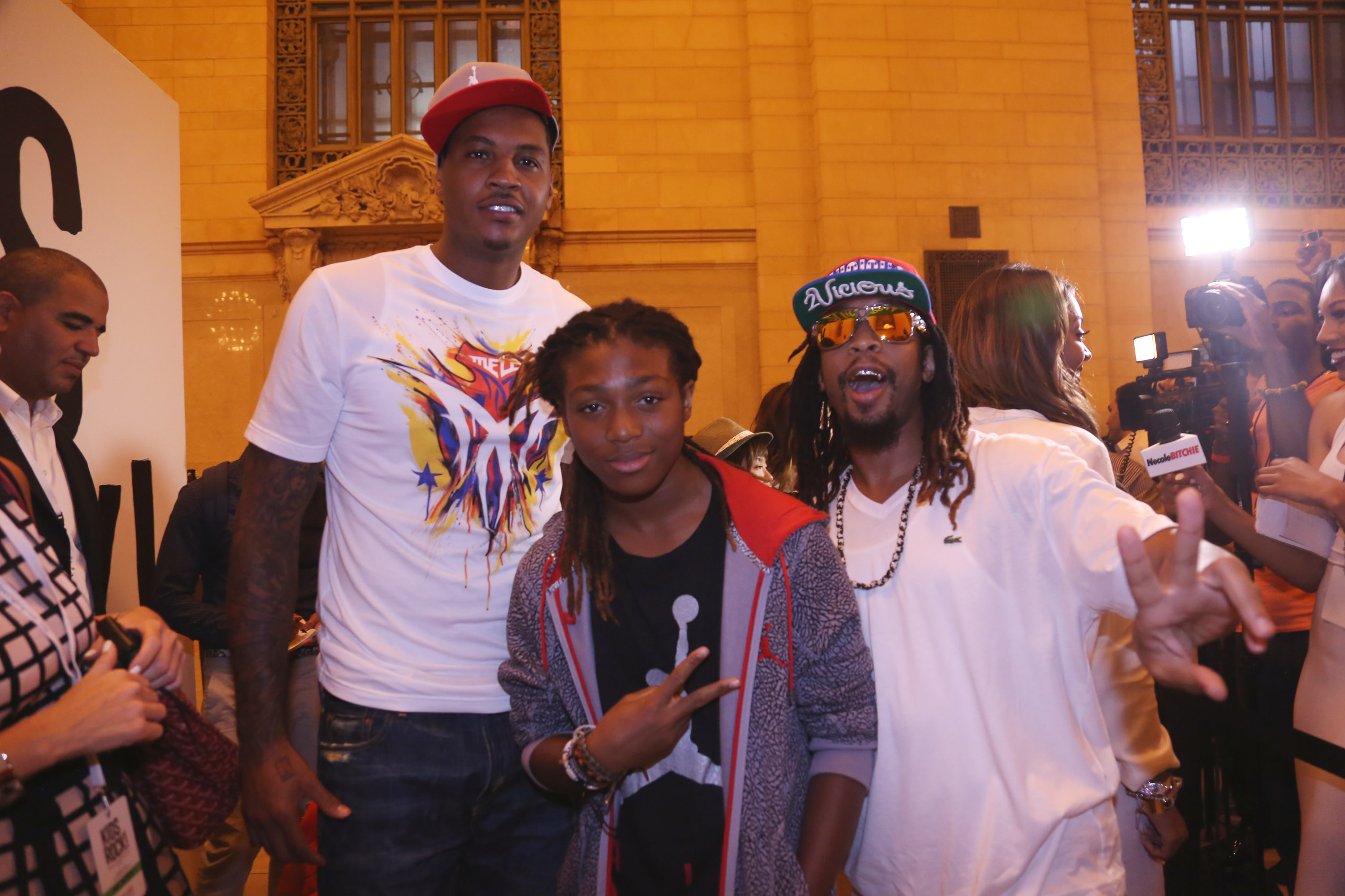DJ Young Slade, Lil Jon and Carmelo Anthony attend the Kids Rock! Celebrity Fashion Show at Grand Central Terminal in New York City on September 11, 2013. | Source: Getty Images