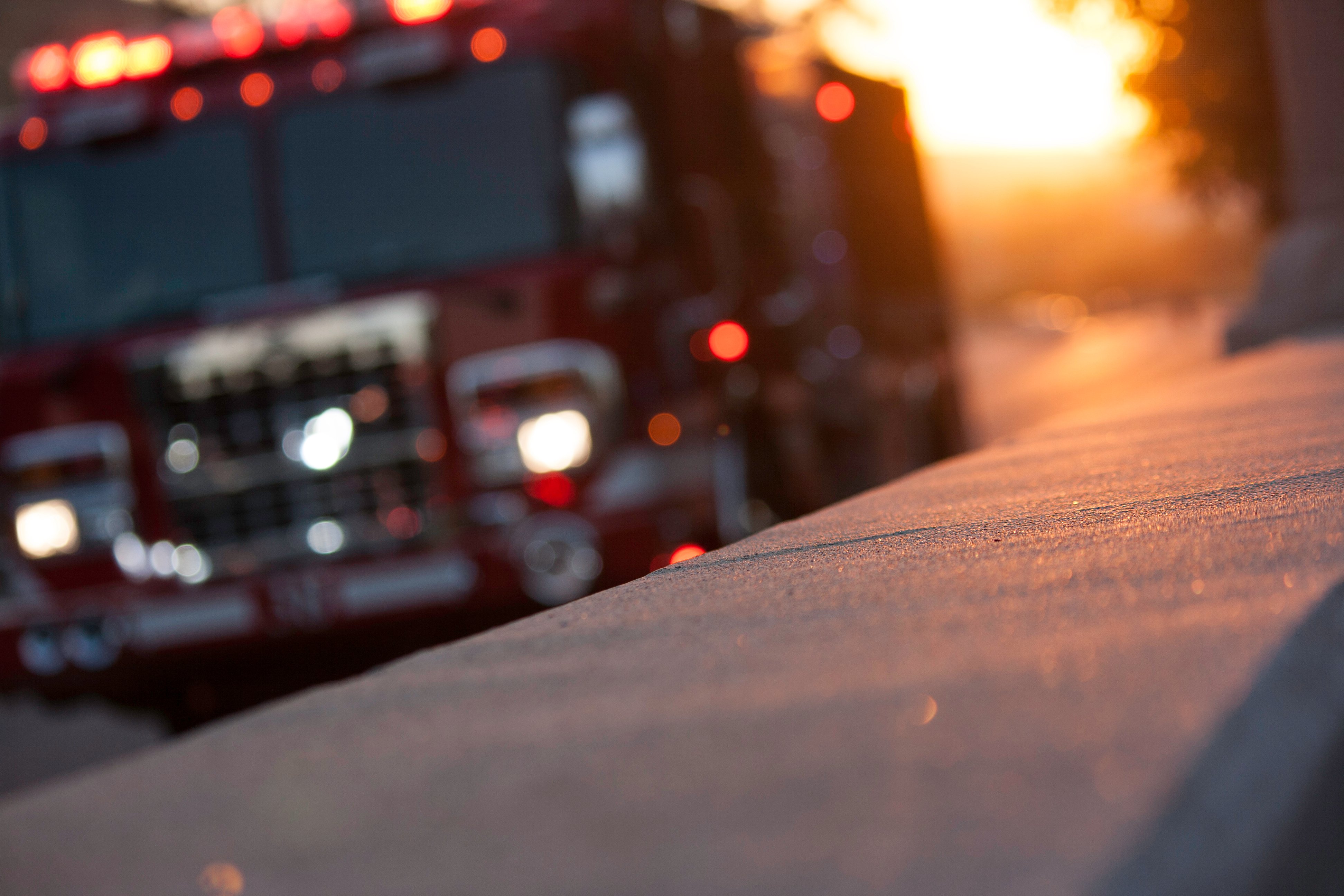 Fire truck driving down a road. | Source: Shutterstock 