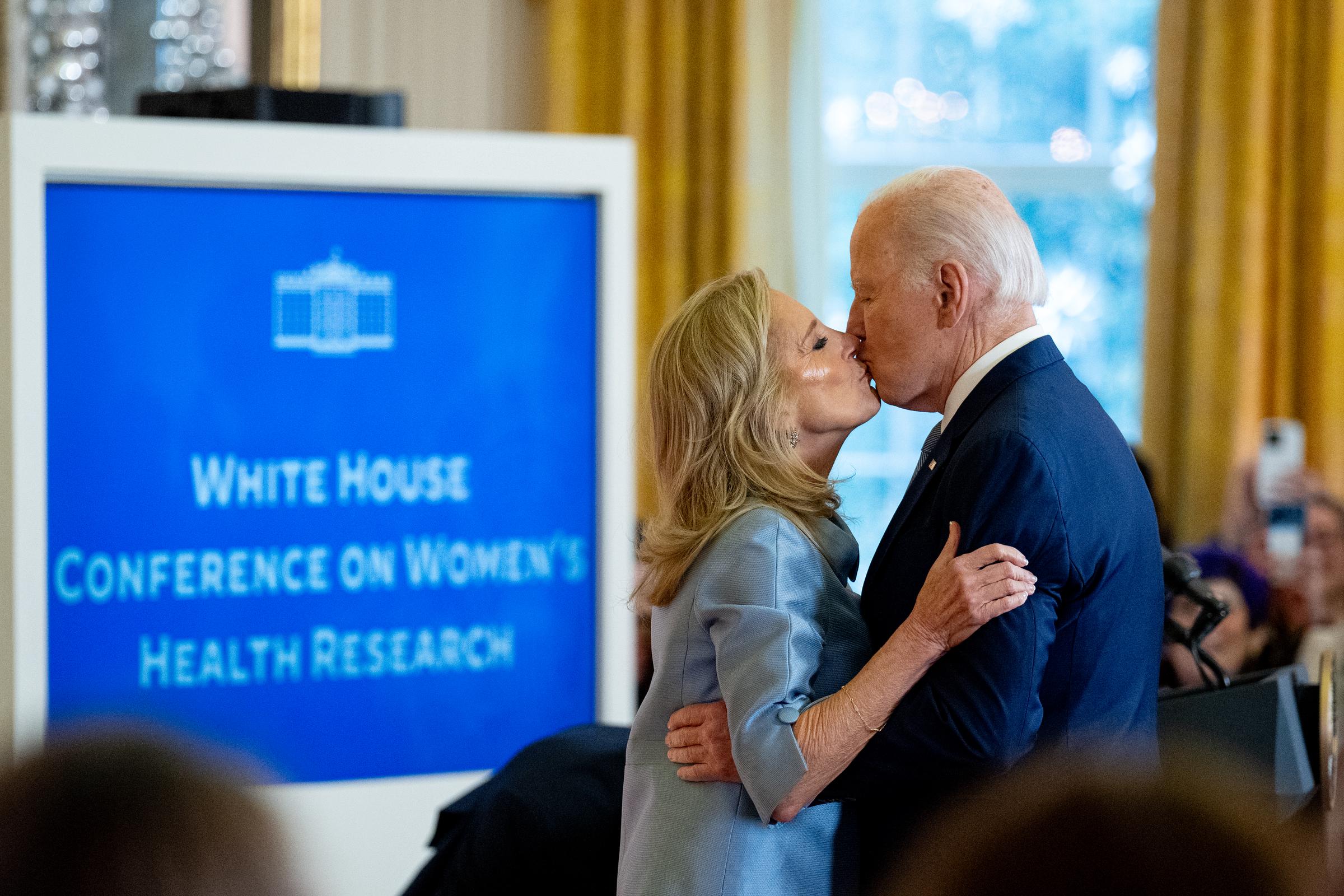 US President Joe Biden and First Lady Jill kiss during the first White House conference on women's health research at the White House on December 11, 2024, in Washington, D.C. | Source: Getty Images