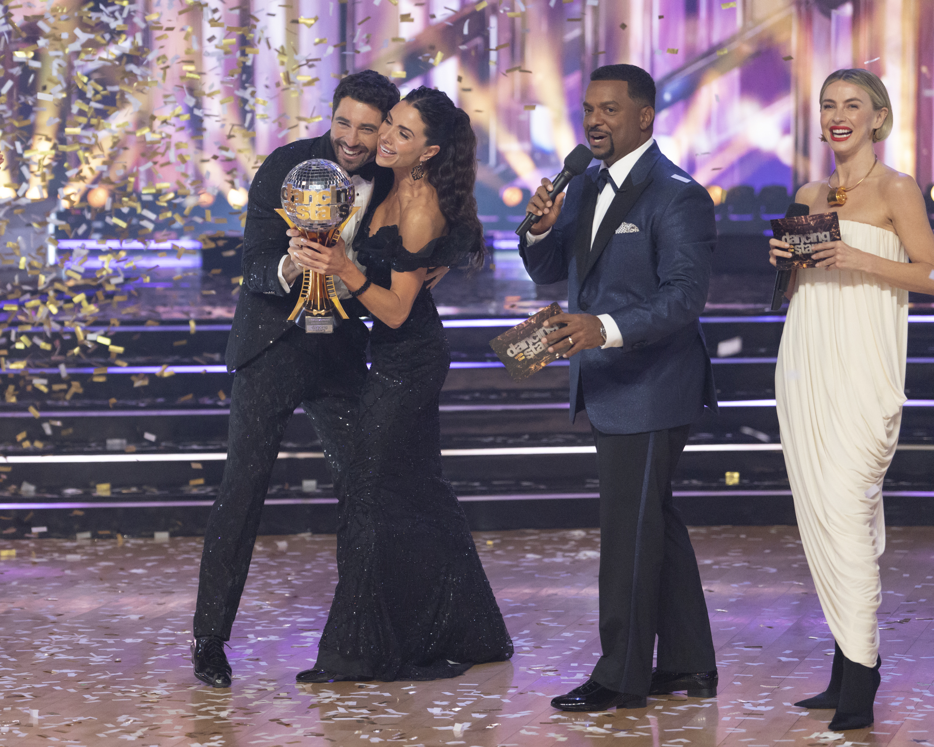 Joey Graziadei, Jenna Johnson, Alfonso Ribeiro, and Julianne Hough after Graziadei and Johnson were declared the winners during the "DWTS" finale. | Source: Getty Images