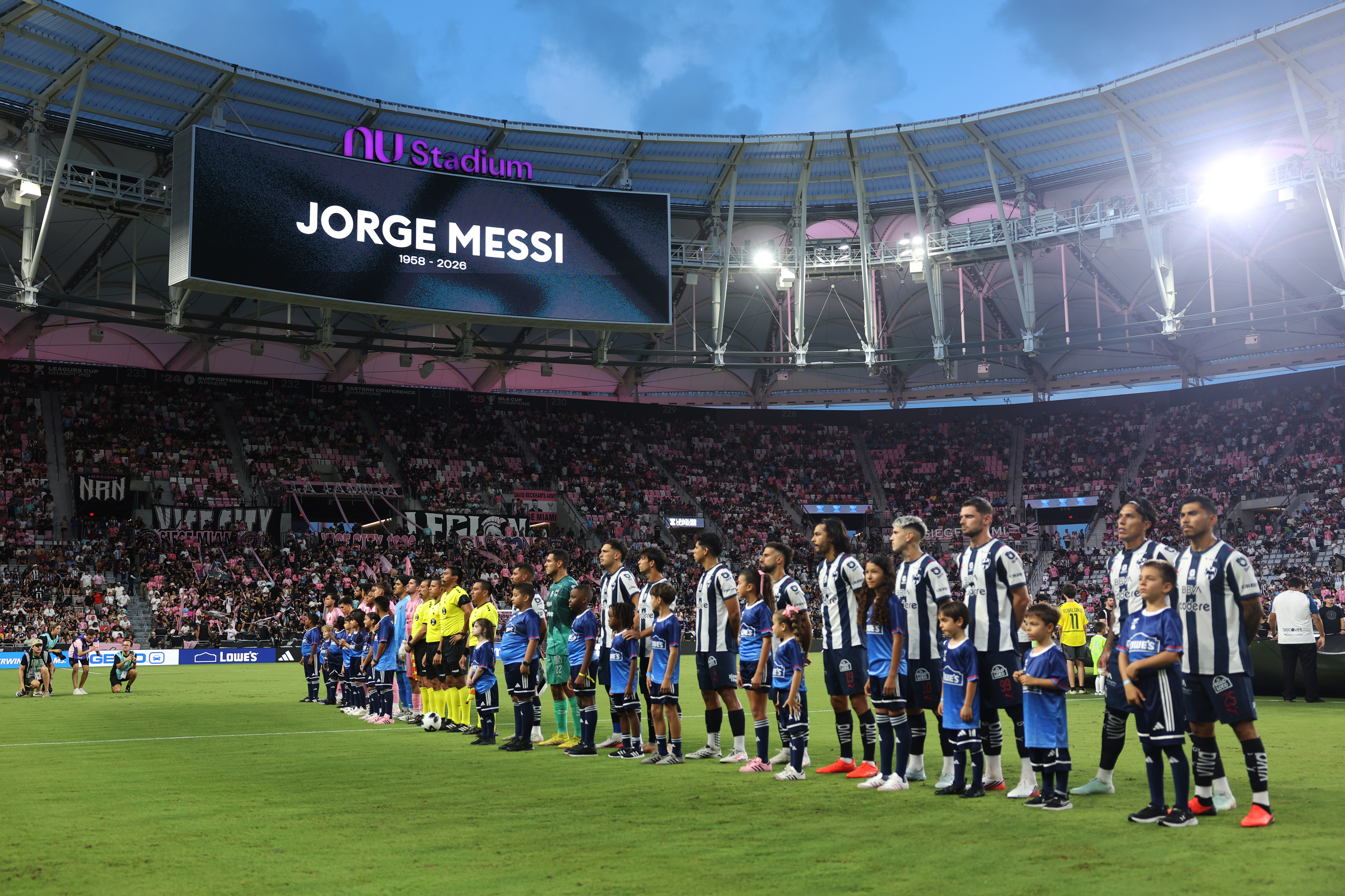 Players and match officials observed a minute of silence to honor the memory of Lionel Messi's father, Jorge Messi. In this photo, they stood together prior to the Leagues Cup Phase One match between Inter Miami CF and CF Monterrey at Nu Stadium on August 8, 2026, in Miami, Florida. | Source: Getty Images