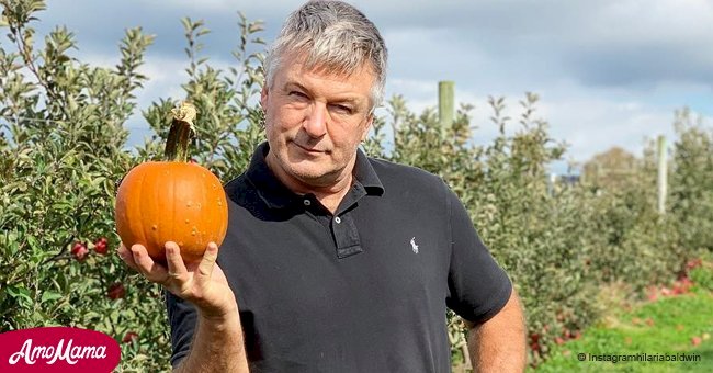 Alec Baldwin shows fans his little daughter as they pose with pumpkins in a pre-Halloween photo