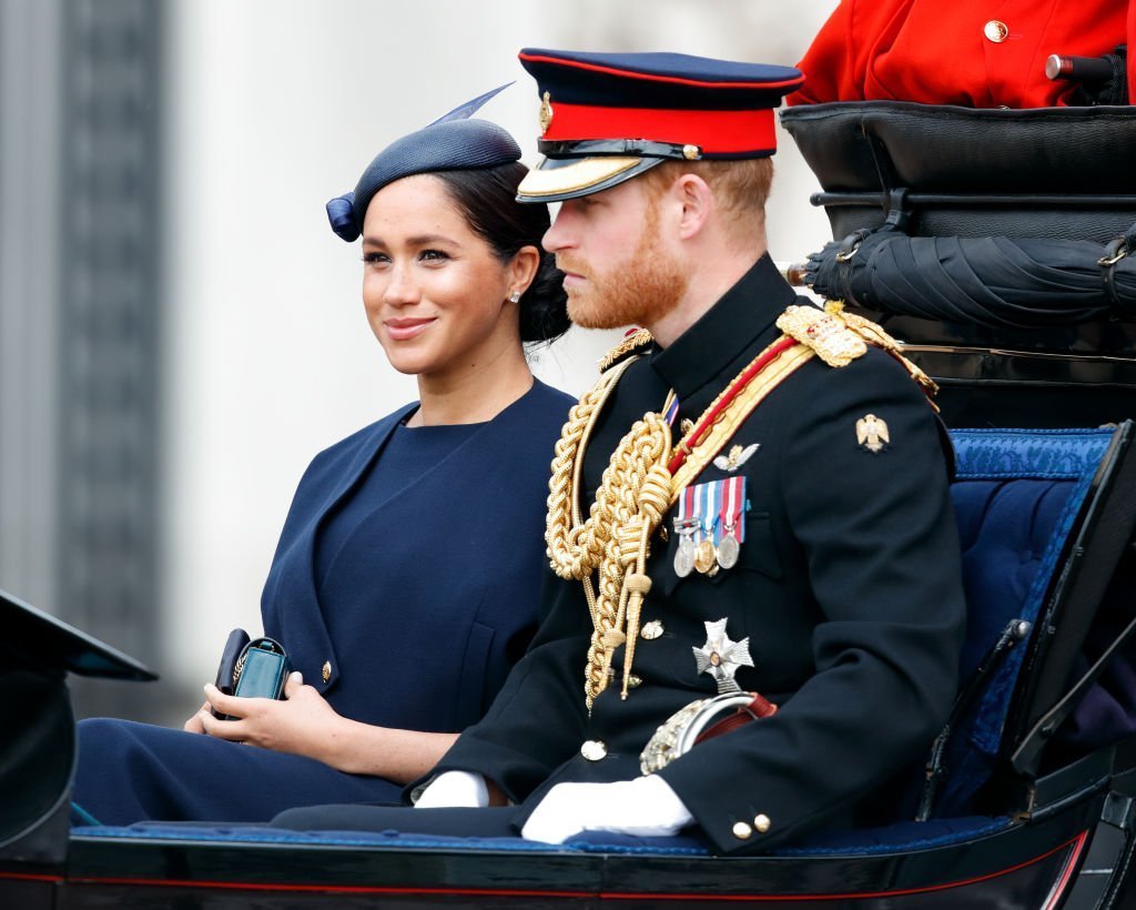 Meghan, Duchess of Sussex and Prince Harry, Duke of Sussex travel down The Mall in a horse drawn carriage as they attend Trooping The Colour, the Queen's annual birthday parade | Photo: Getty Images