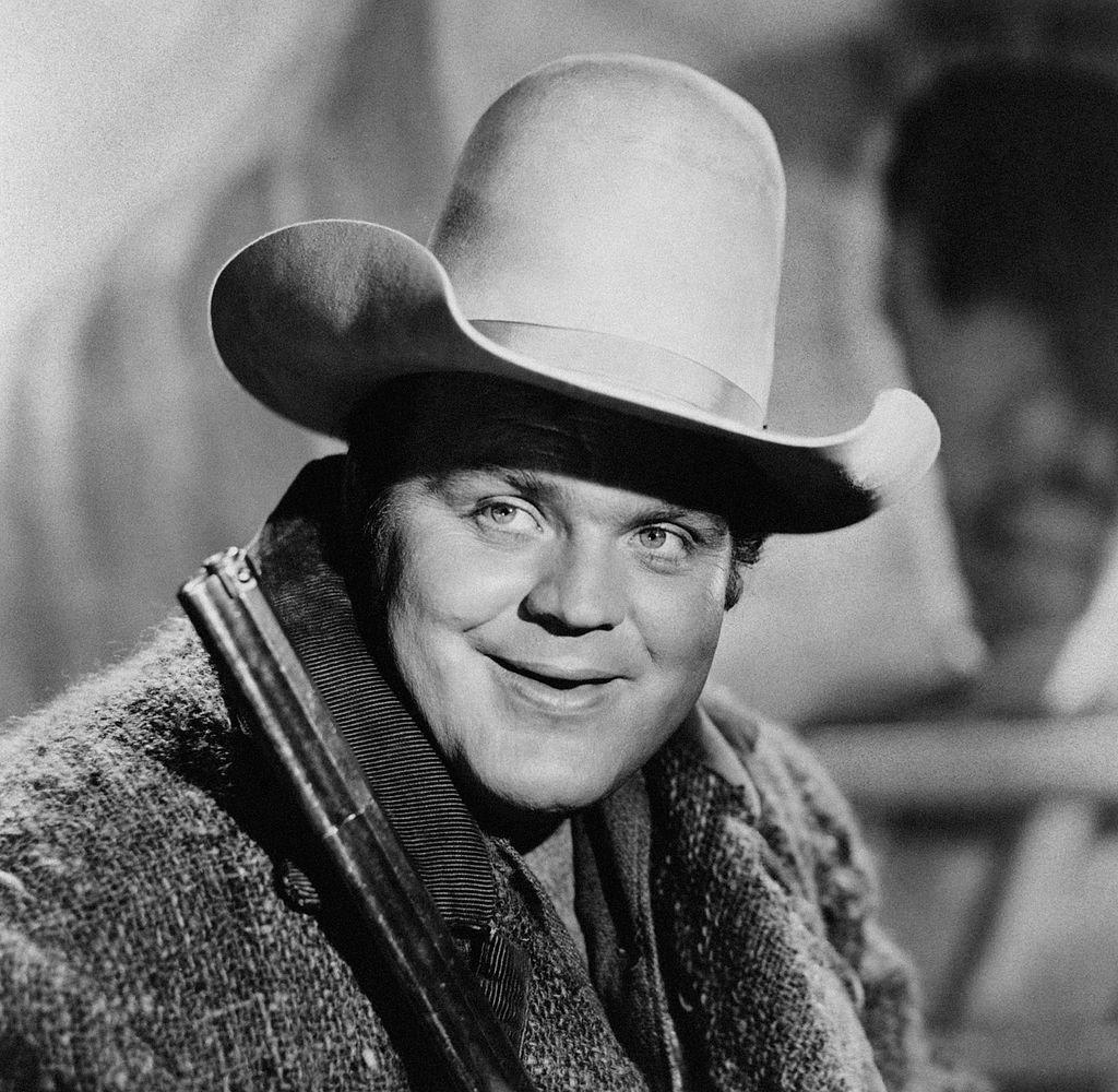 Dan Blocker is photographed with a cowboy hat and a rifle on December 31, 1955 | Photo: Getty Images