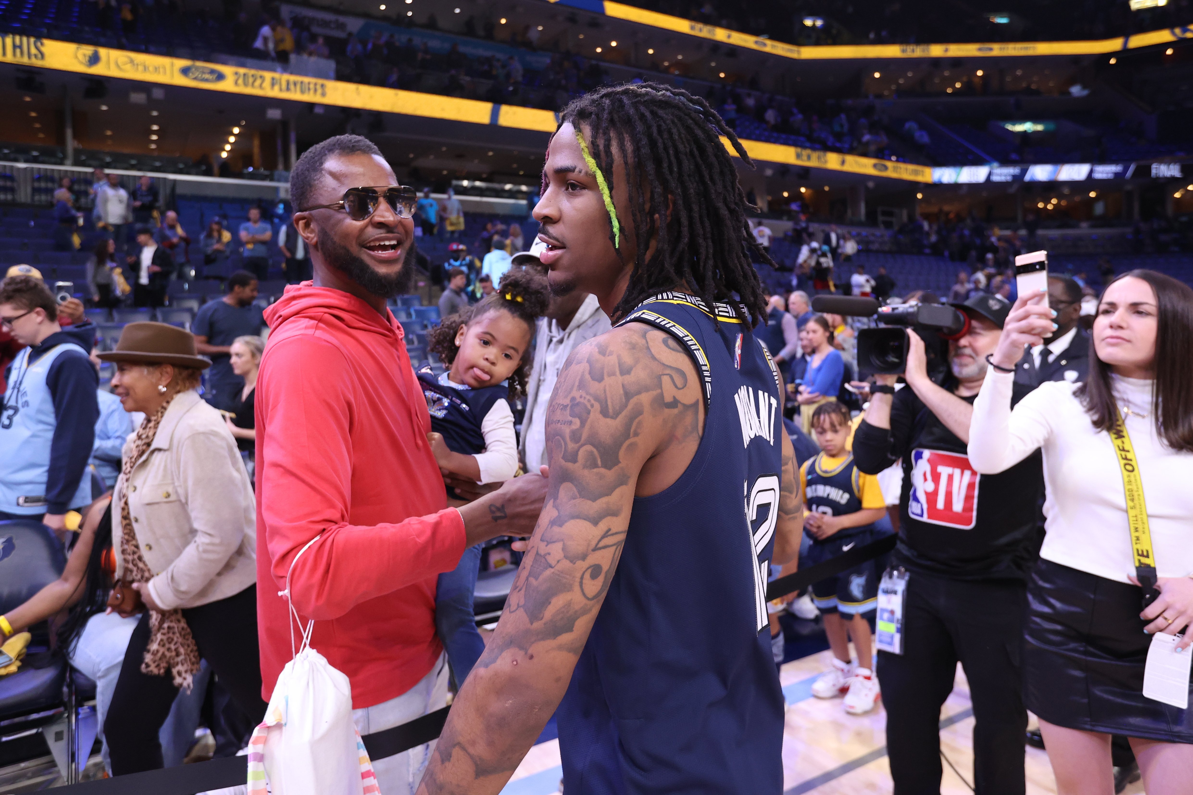 Ja Morant and Tee Morant at a Grizzlies VS Minnesota Timberwolves Game 2 of the NBA Playoffs on April 19, 2022, at FedExForum in Memphis, Tennessee. | Source: Getty Images