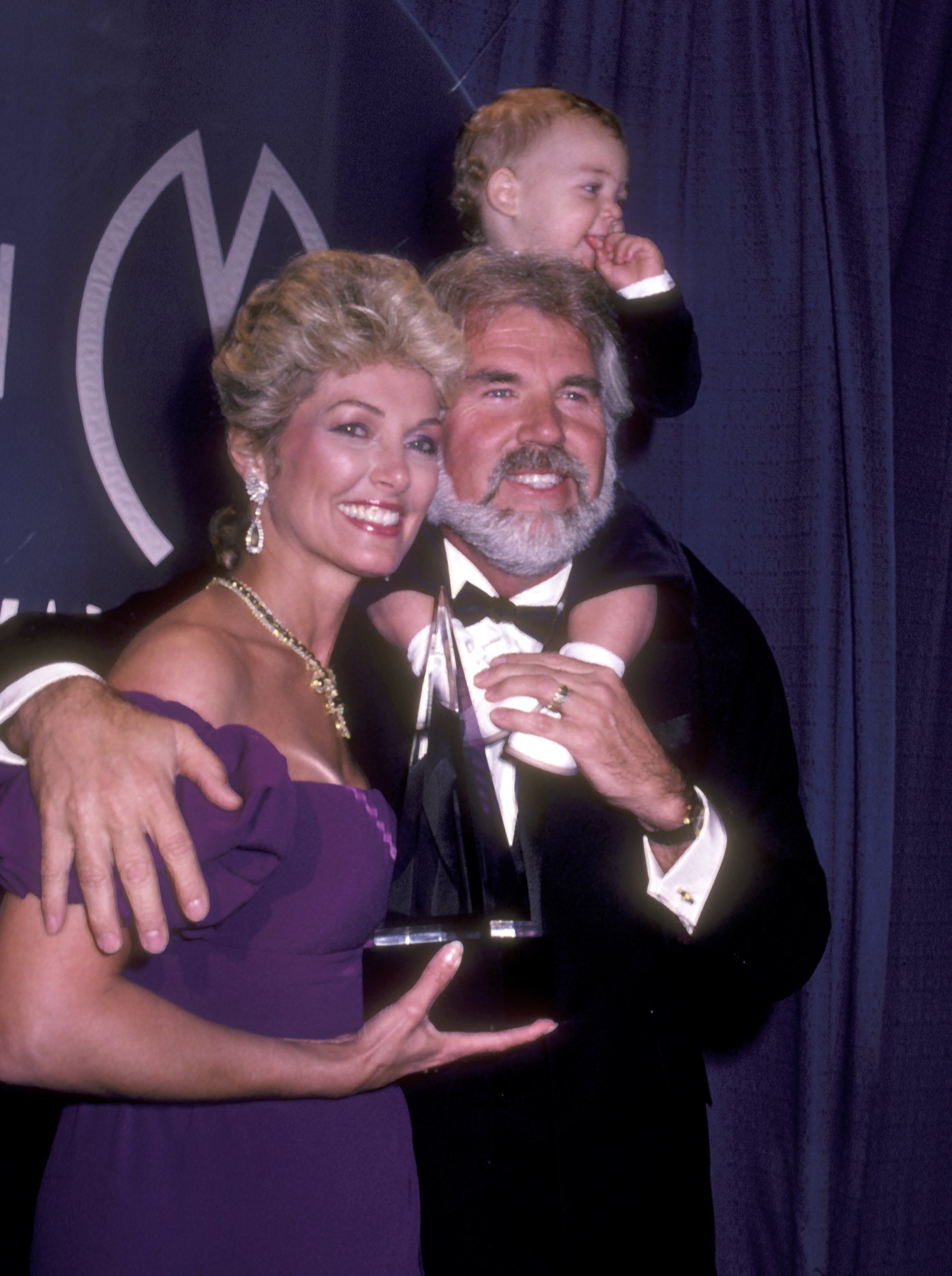 Musician Kenny Rogers, wife Marianne Gordon, and son Christopher Rogers attend the 10th Annual American Music Awards on January 17, 1983 at Shrine Auditorium in Los Angeles, California. | Source: Getty Images